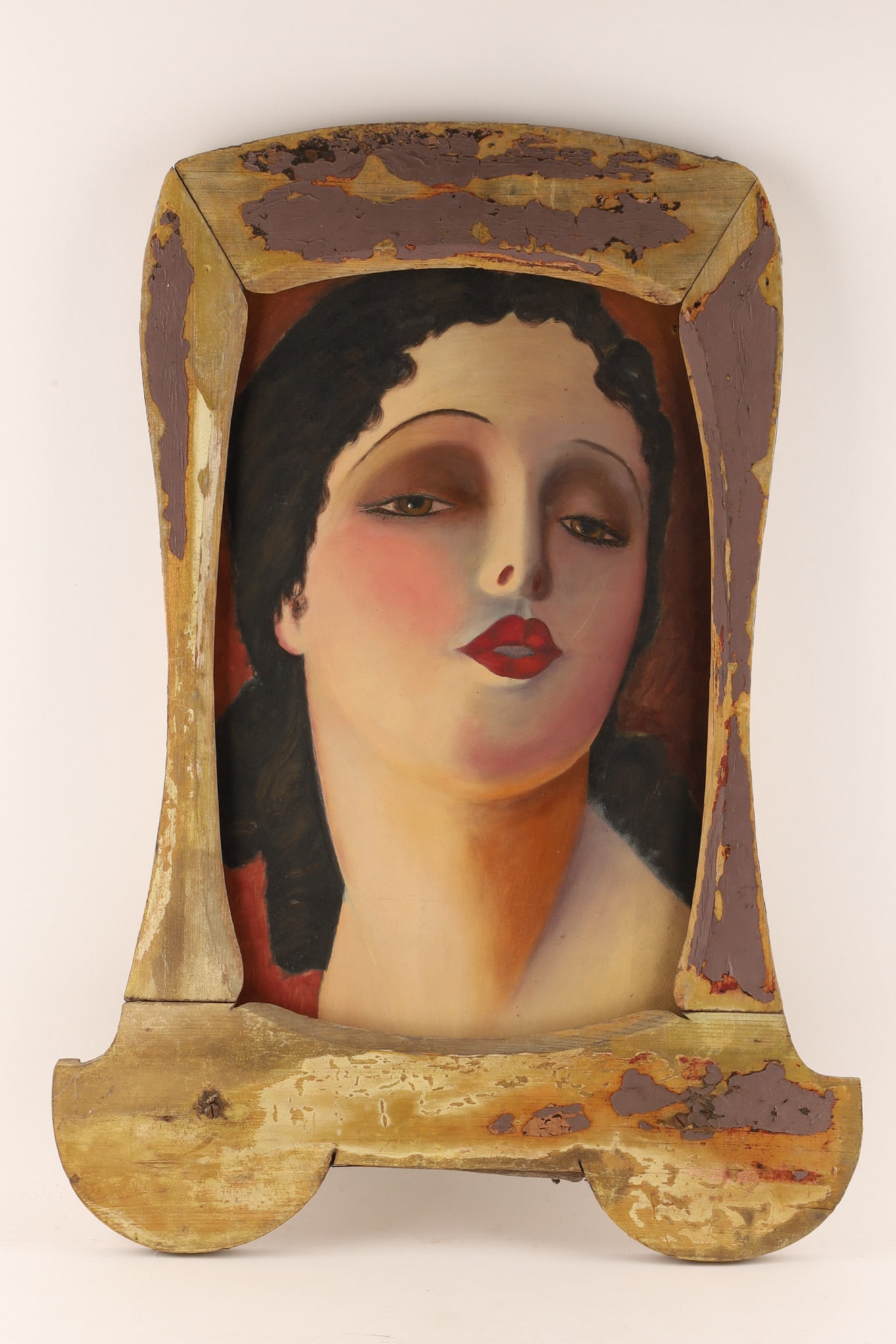 Art Deco Style Portrait of a Lady on Board in Carved Wood Frame, Tamara de Lempicka Style: Continental School, 20th Century Portrait of a Lady, oil on board, depicting an elegant female bust with stylized features rendered in the Art Deco manner, against a warm crimson ground. Presented in 