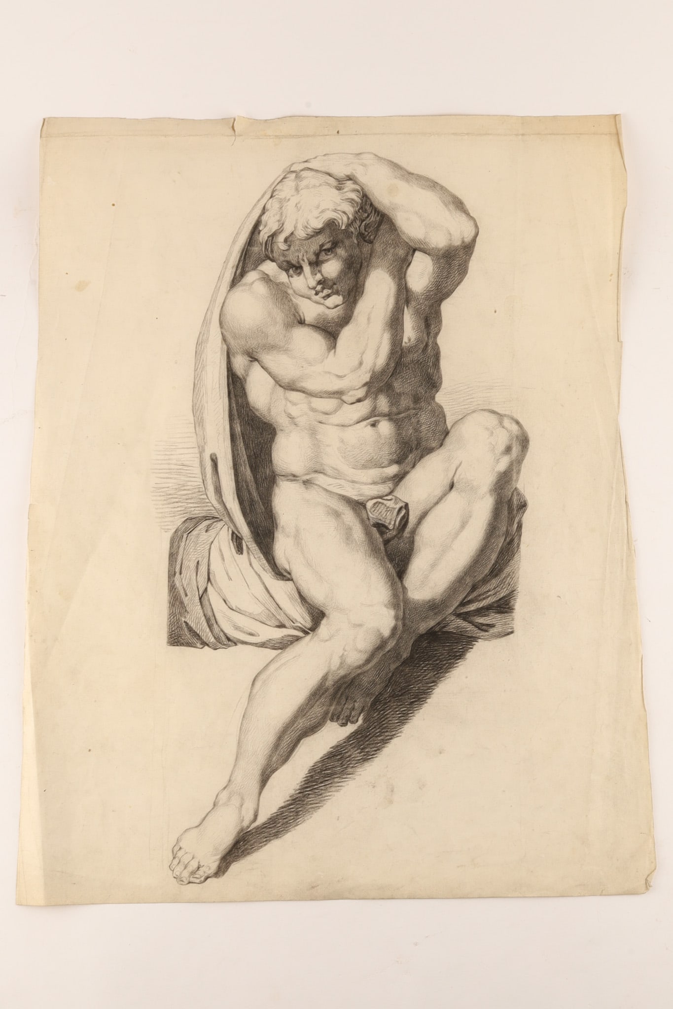 Michelangelo Buonarroti (Italian, 1475-1564), After, Drawing of a Seated Male Nude (Ignudo) from: After Michelangelo Buonarroti (Italian, 1475-1564) Seated Male Nude (Ignudo) Antique academic drawing on paper depicting a muscular seated male nude after one of Michelangelo's celebrated ignudi from 