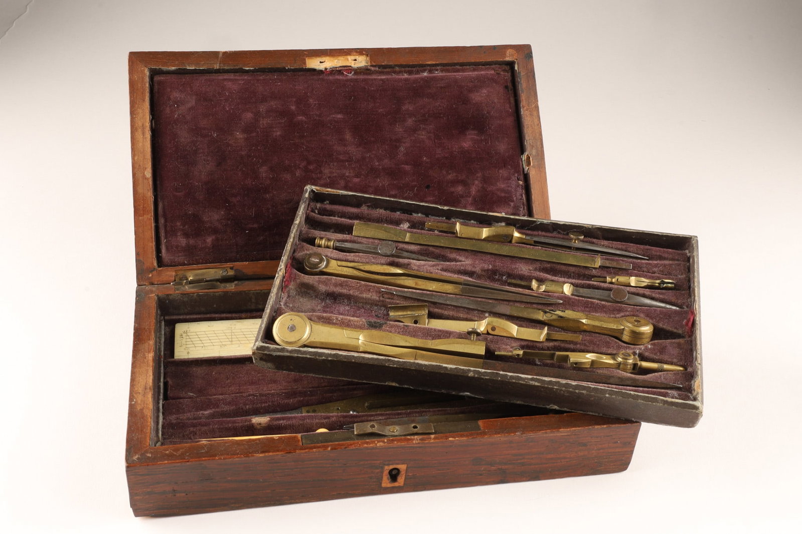 Antique Brass Drafting Instrument Set in Mahogany Case: Antique Brass Drafting Instrument Set, late 19th/early 20th century, comprising a comprehensive assortment of precision brass and steel mathematical and engineering drawing instruments, including beam