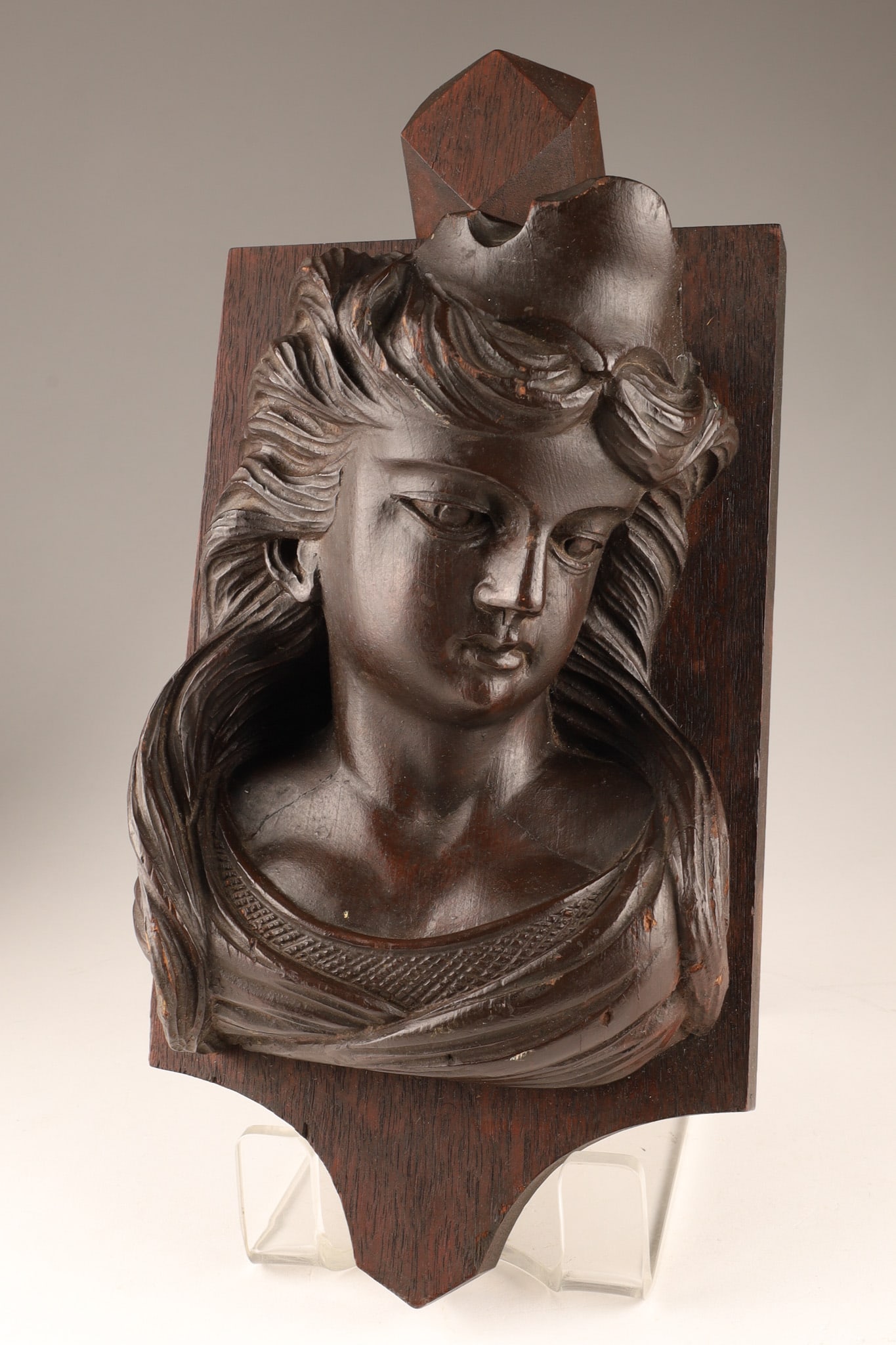 Antique Continental Black Forest Style Carved Wood Female Profile Bust: Antique Continental Black Forest Style Carved Wood wall plaque bust depicting a young woman with a serene expression and flowing hair. Hand-carved in a naturalistic Black Forest / Alpine style on a sh