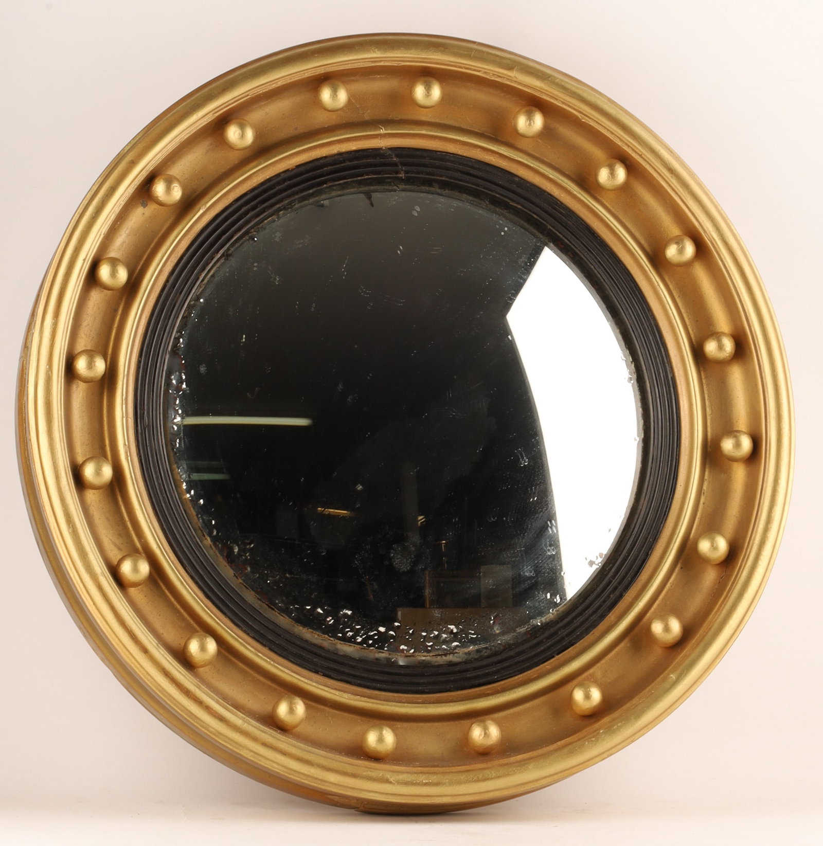 Antique Convex Mirror In a Regency Style Frame C.1900: Antique Regency-style convex bullseye mirror featuring a rounded giltwood frame decorated with 20 regularly spaced ball accents. Found with newspaper clipping in frame dating to August 17th, 1900 from