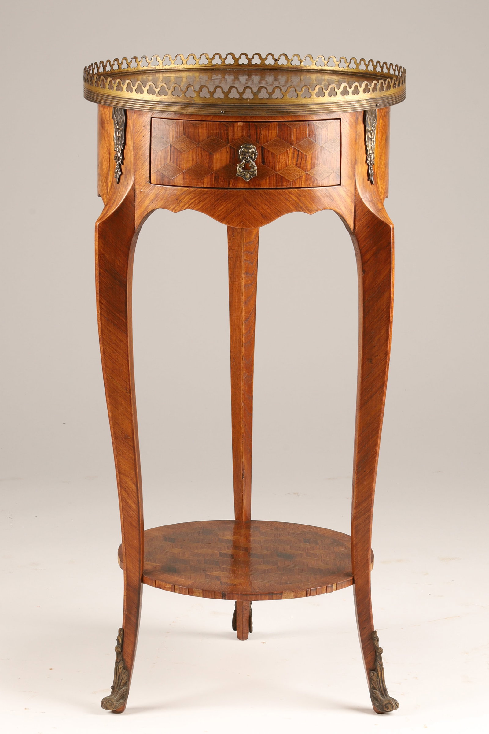 Antique French Parquetry Gueridon Side Table Louis XV/XVI Style: An antique French-style small occasional side table / gueridon or petite table in the Louis XV/XVI Transition style, featuring a raised gallery rim, a single small drawer, cabriole legs, and a lower t
