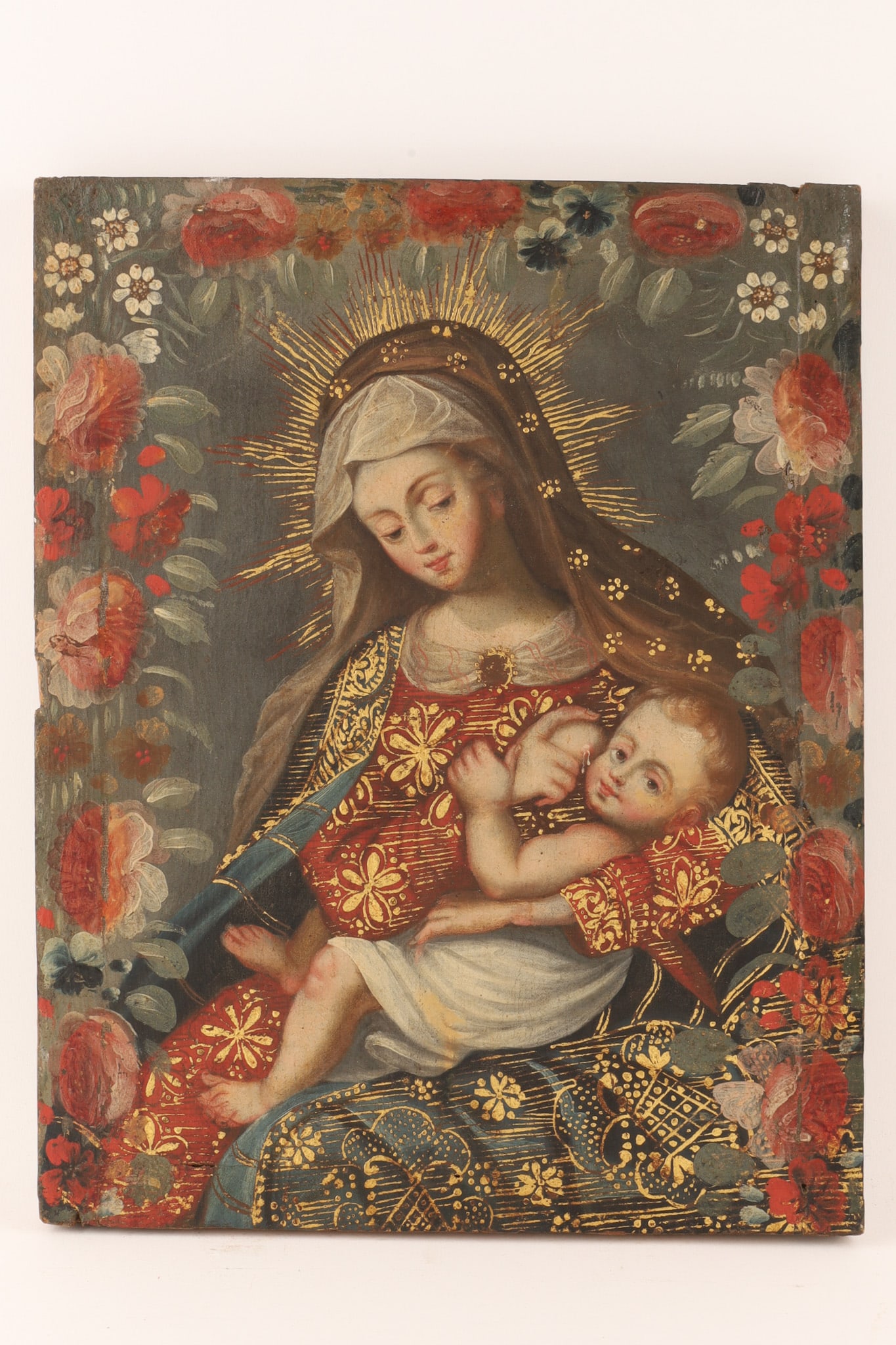 Spanish Colonial School Virgen de la Leche / The Nursing Madonna Oil on Canvas: Spanish Colonial School / Quito School oil on canvas depicting the Virgen de la Leche (The Nursing Madonna). The work shows the Virgin Mary breastfeeding the Christ Child, featuring delicate skin tone