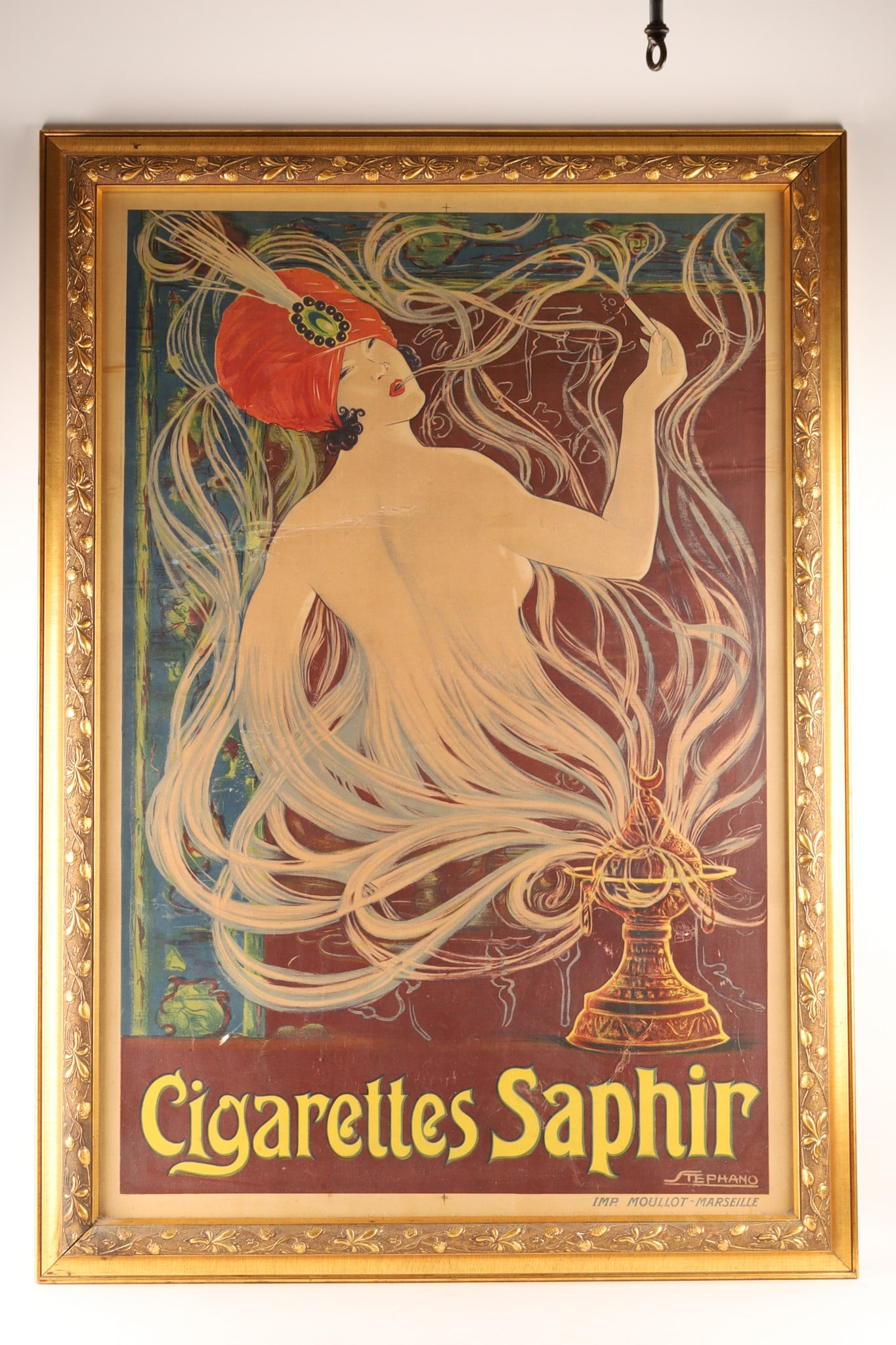 Art Nouveau Cigarettes Saphir Lithographic Poster by Stephano: An Art Nouveau vintage French advertising lithograph Cigarettes Saphir designed by the artist Stephano around 1910-1925 and printed by Imprimerie Moullot in Marseille, France, featuring flowing, organ