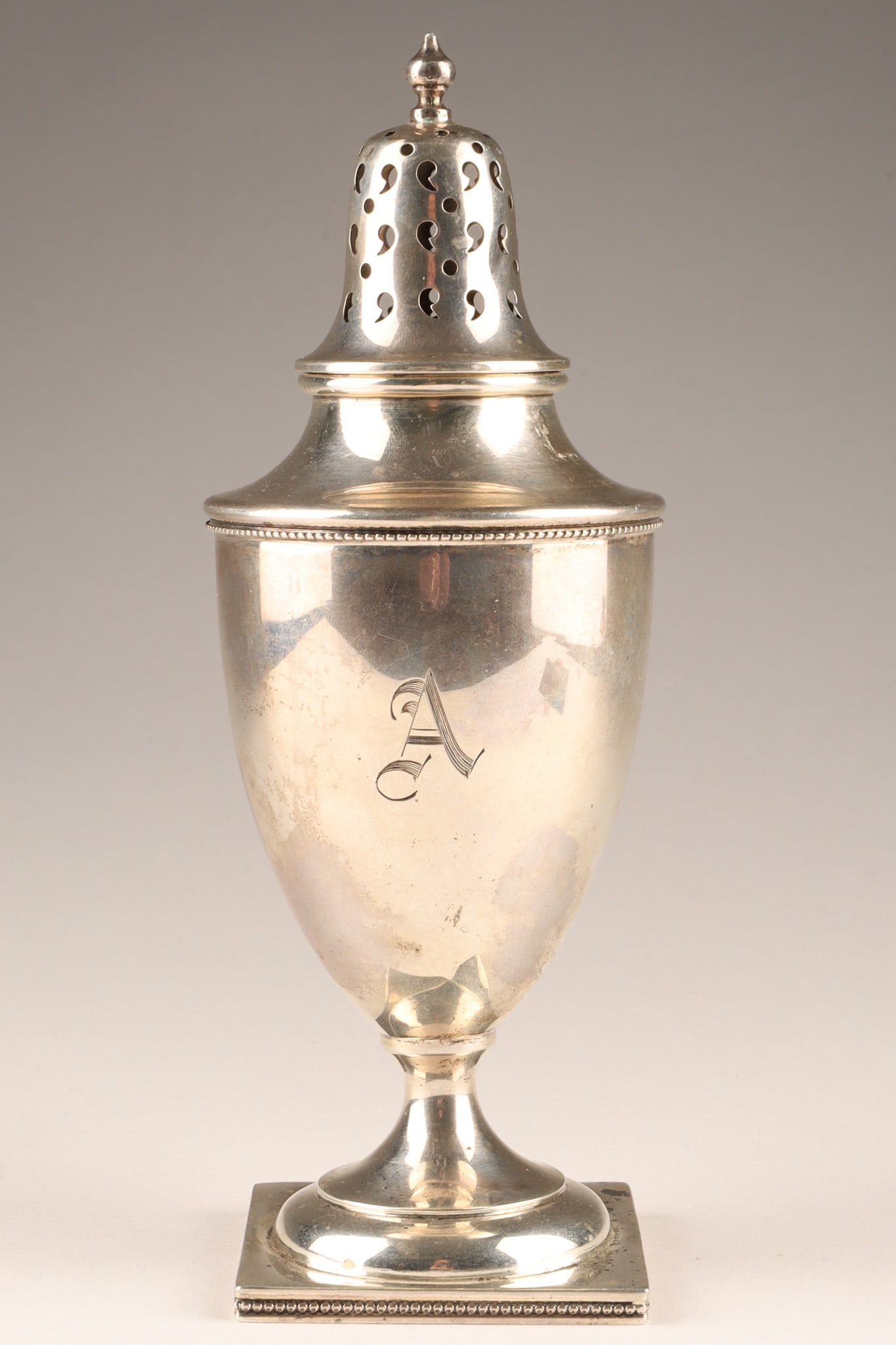 Antique Birks Canadian Sterling Silver Sugar Caster, Georgian Urn Style: A 7.25-inch antique Georgian-style sterling silver sugar caster by Henry Birks and Sons. Features a classic Neoclassical urn shape on a beaded square pedestal foot, it showcases delicate teardrop hand