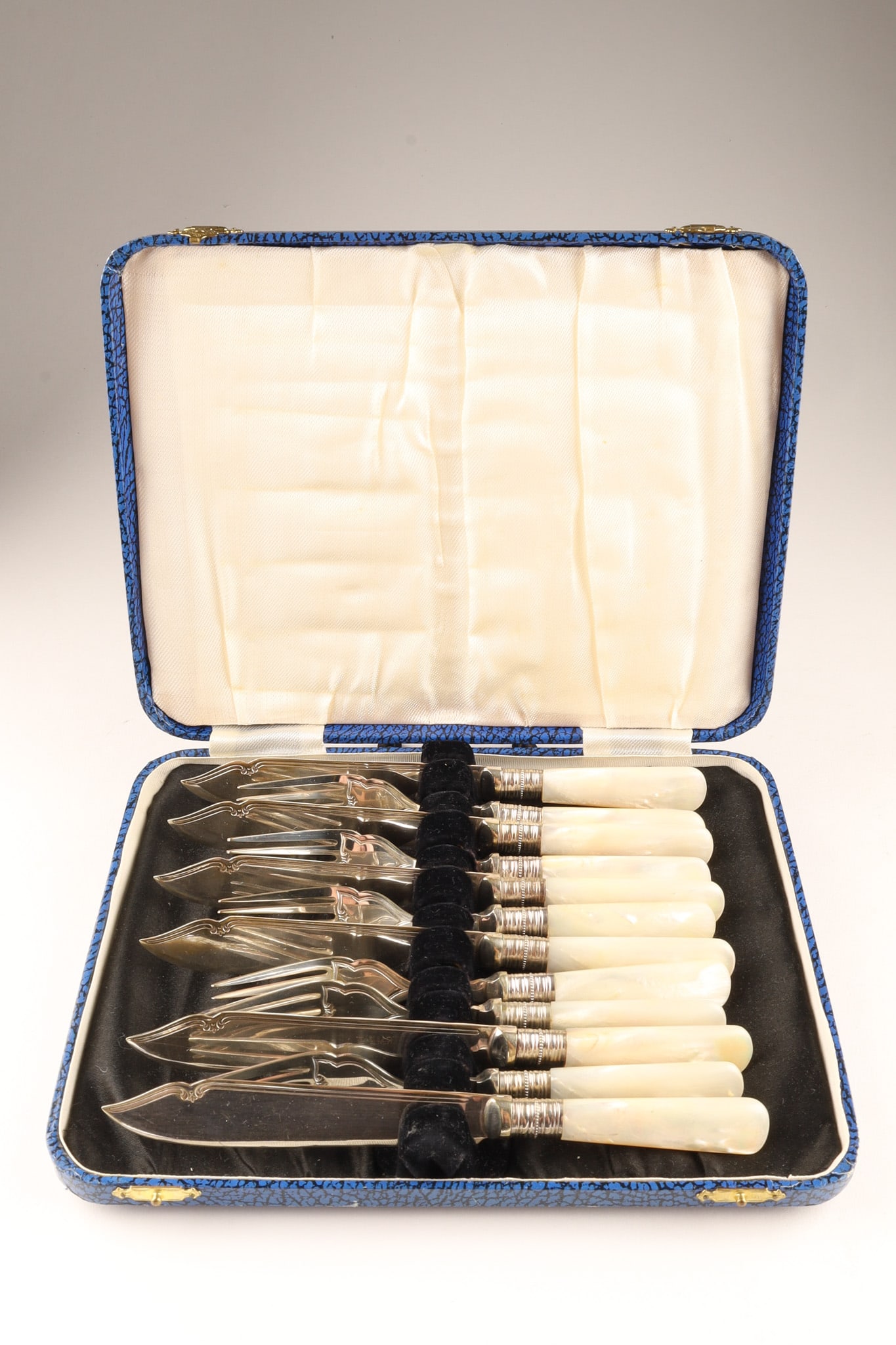 Antique Mother of Pearl and Silver-Plated Fish Cutlery Service for 6 by Richard Martin: A late 19th to early 20th-century Victorian/Edwardian 12-piece fish dining set comprising 6 forks and 6 knives. Features meticulously engraved electroplated nickel silver (EPNS) blades and tines beari