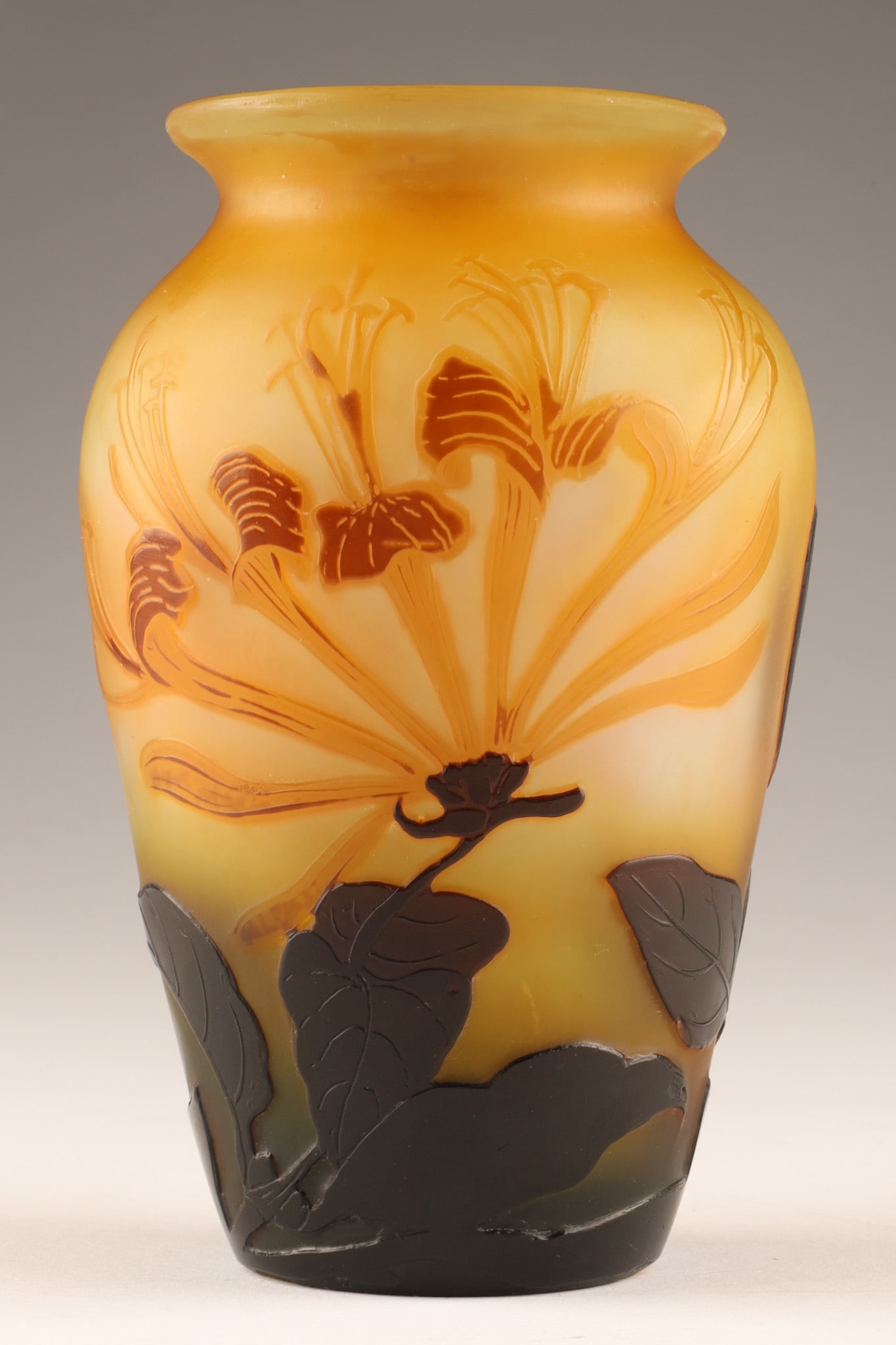 Antique Emile Galle Art Nouveau Cameo Glass Honeysuckle Vase, c.1900: Art Nouveau cameo glass vase by legendary French master Emile Galle. Handcrafted in Nancy, France, this piece features multi-layered, acid-etched casing depicting an intricate botanical motif of flowe
