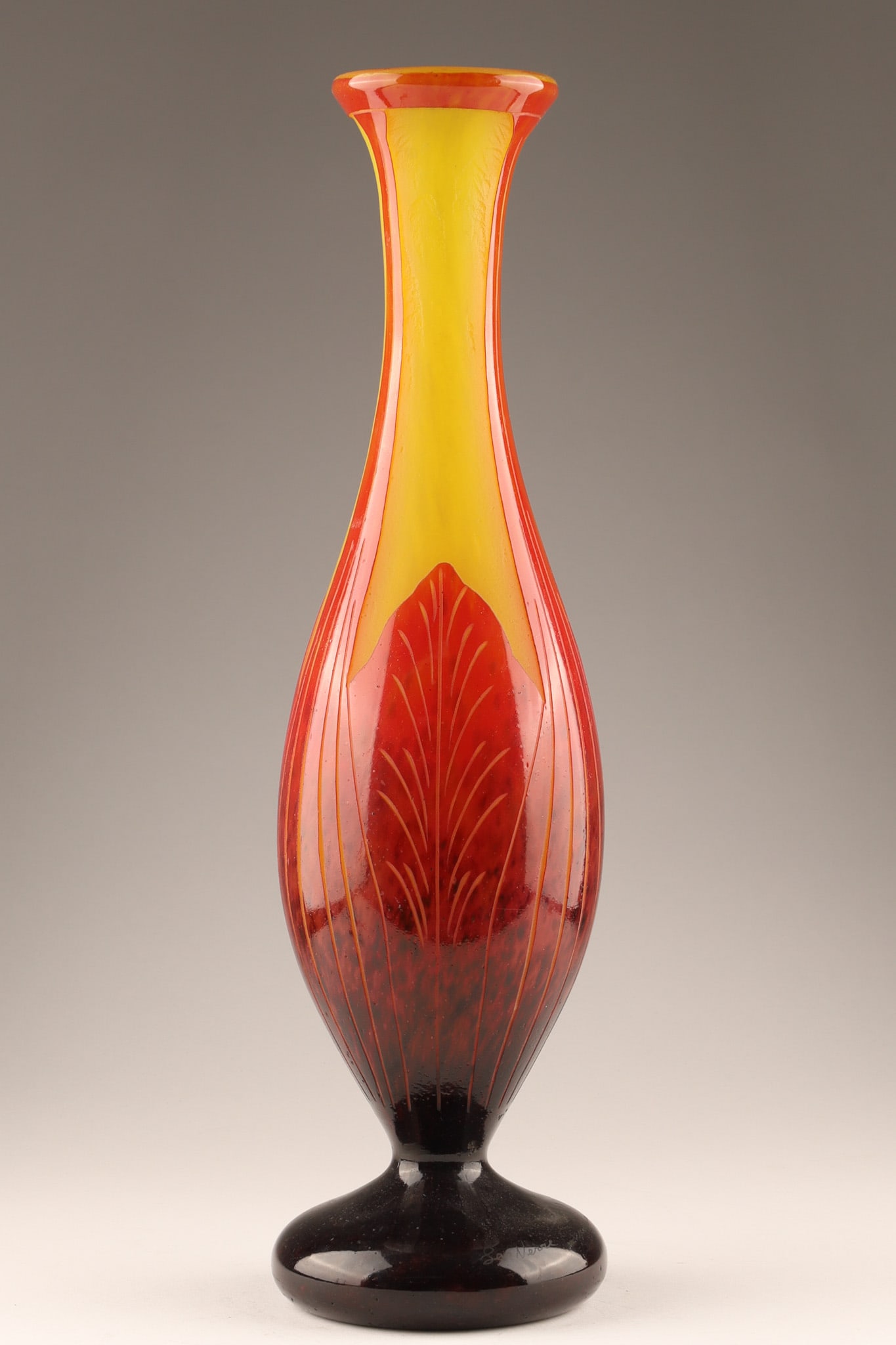 Art Deco Le Verre Francais Feuilles de Tabac Vase by Verreries Schneider: Art Deco cameo glass Le Verre Francais Feuilles de Tabac (Tobacco Leaves) vase designed by Verreries Schneider c. 1922-1923. Clear overlaid glass with acid-etched red and yellow powder inclusions. Mar