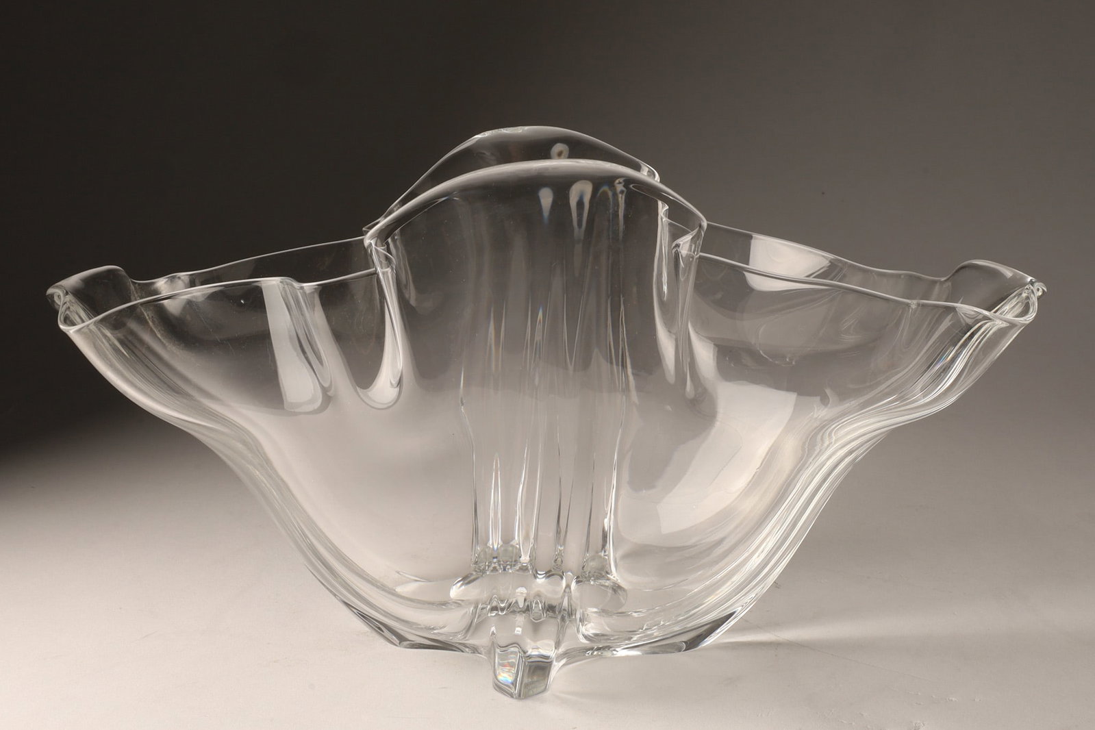 Steuben Grotesque Art Glass Freeform Bowl, Signed: A vintage Steuben Grotesque art glass bowl features a free-form, undulating rim and a solid base by Frederick Carder or Bolislav Mankowski. Measuring 6 inches H x 12 W x 7 deep. Signed on base. 