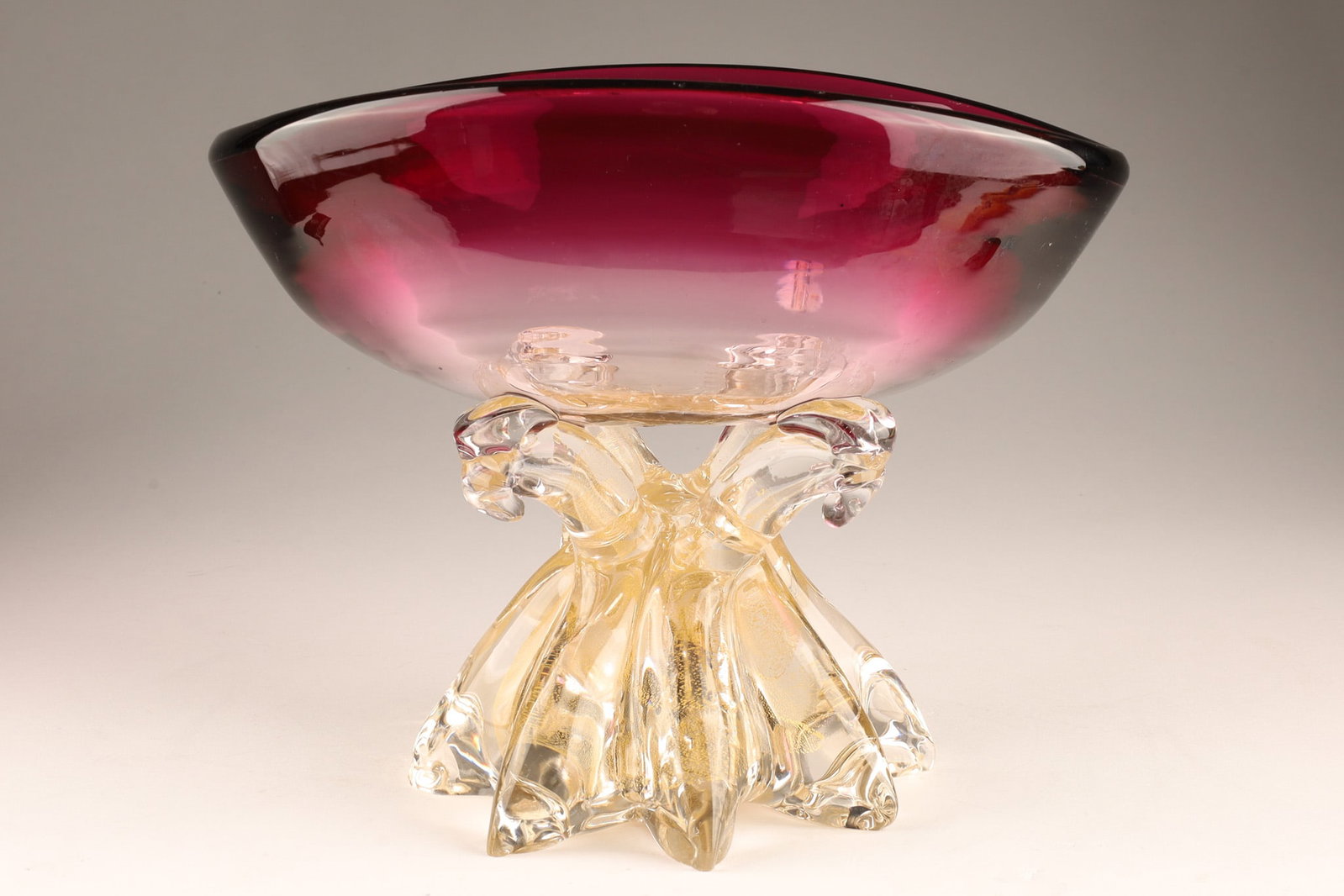 Mid Century Murano Glass Bowl Magenta with Gold Infused Base: Mid Century 1960s Murano Glass Bowl Magenta with Gold Infused Clear Glass Base. Measuring 7.5 inches H x 9 W.