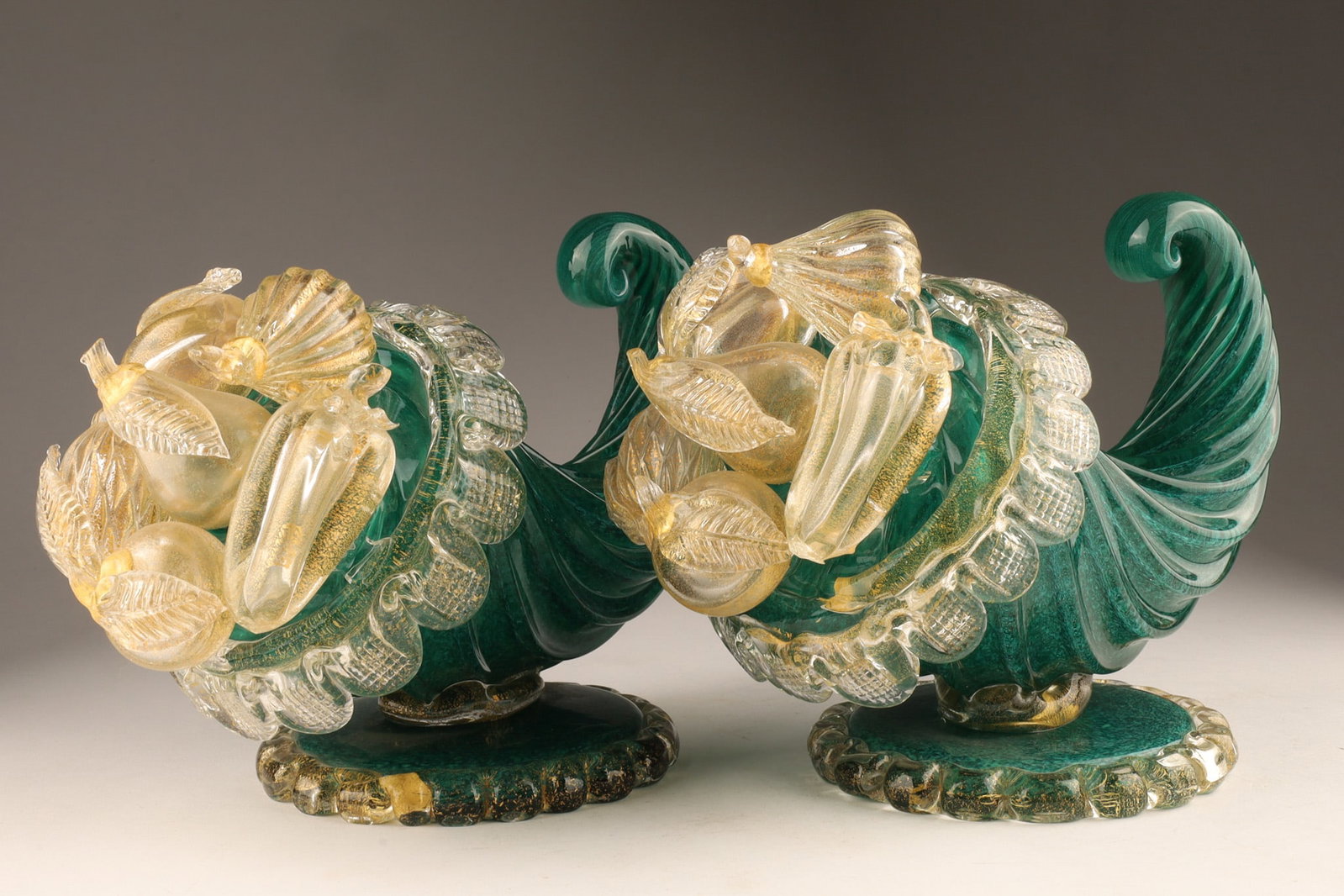 Pair Barovier and Toso Murano Italy Cornucopia Sculptures c.1950s (original label): A pair of vintage Mid-Century Modern Italian Murano art glass cornucopia centrepieces/sculptures by Barovier and Toso, circa 1950s. Each piece features a vibrant emerald green blown glass horn decorat
