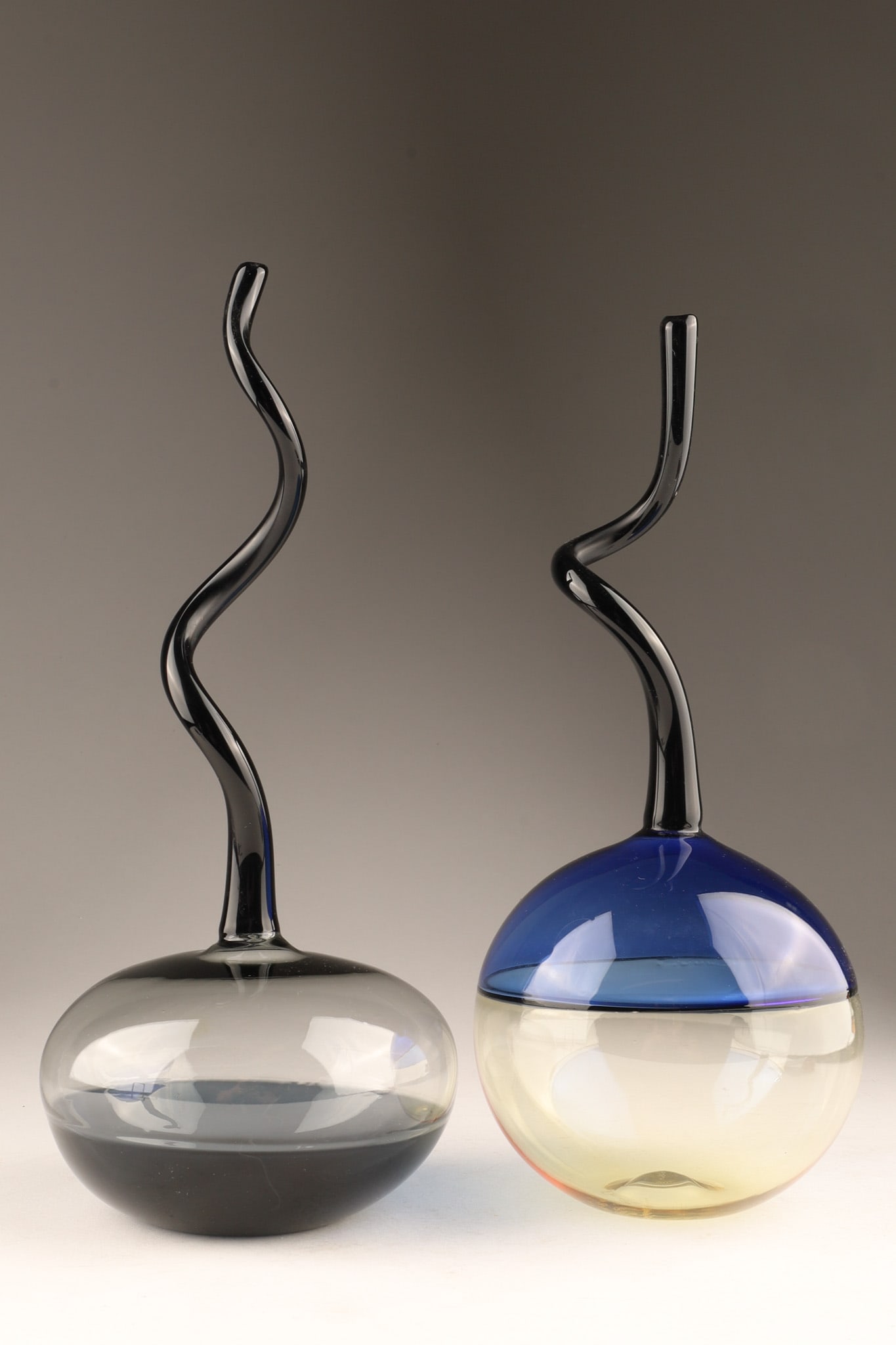 Lot of Murano Glass Incalmo Technique Small Vases Signed: Lot of Two Murano Glass Incalmo Technique Small Vases, where separate bands of colored glass are fused together seamlessly while hot. Each vase features a bulbous, rounded base - one rendered in a two