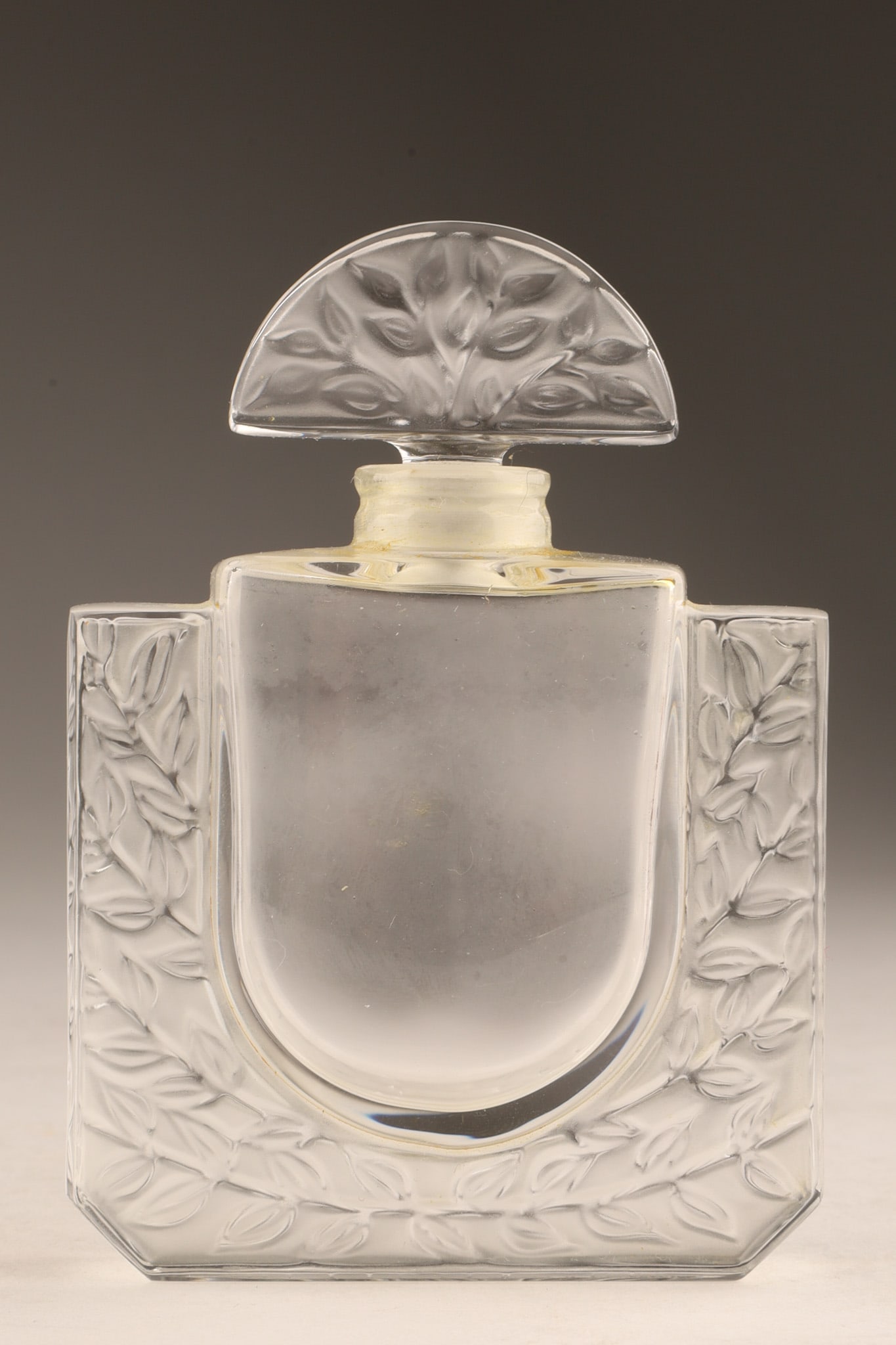Lalique Chevrefeuille (Honeysuckle) Perfume Bottle C. 1992: Lalique Chevrefeuille (Honeysuckle) Perfume Bottle C. 1992. Designed in 1992 as part of Lalique's Limited Edition collection. Features a frosted and molded honeysuckle motif on clear crystal with its 
