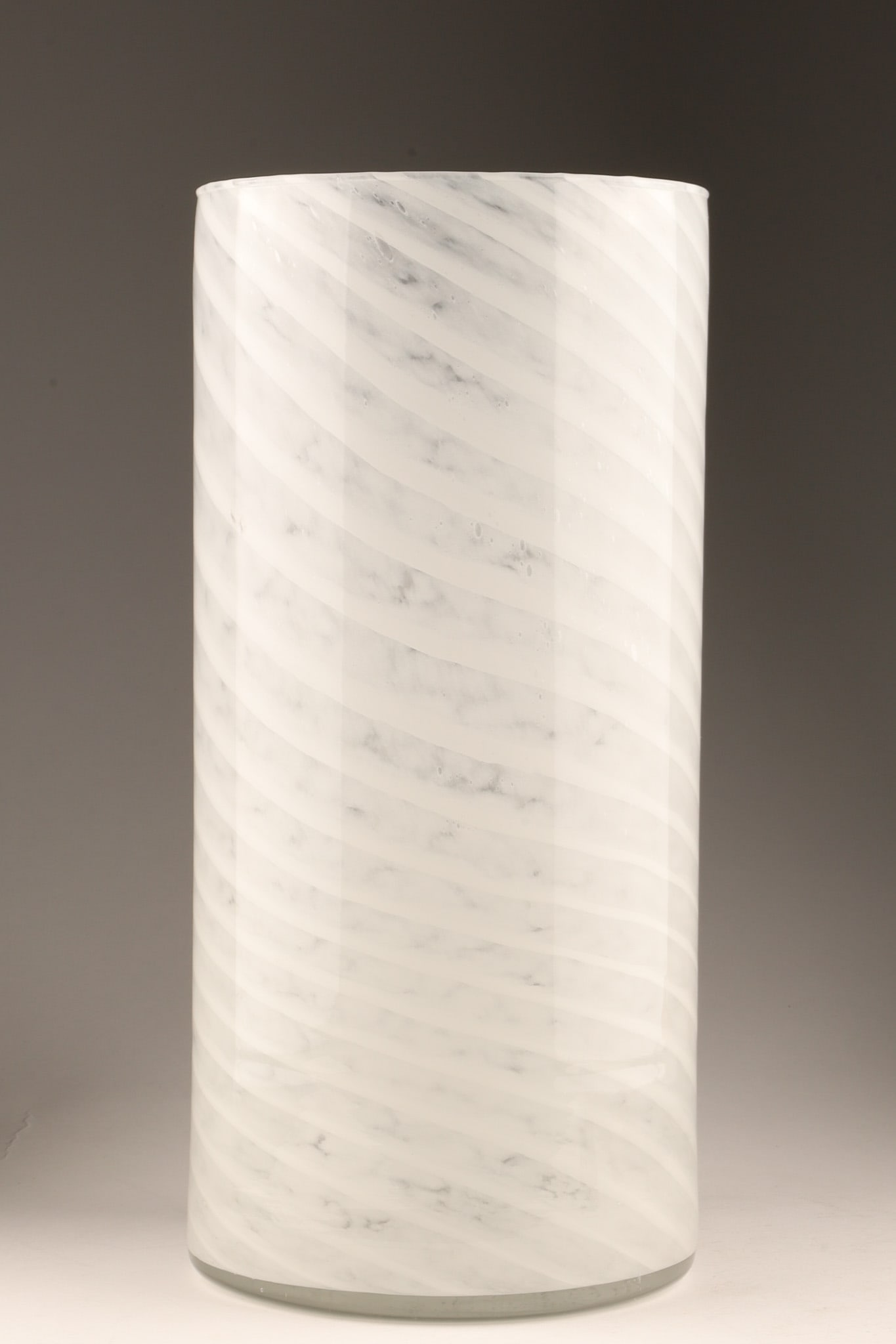 MCM Murano swirl glass cylindrical vase (Gambaro and Poggi) 1970s: A Mid-Century Modern hand-blown Murano art glass cylindrical vase, crafted by the renowned Vetreria Artistica Gambaro and Poggi during the 1970s. The vase features a dynamic, fluid swirl pattern integ