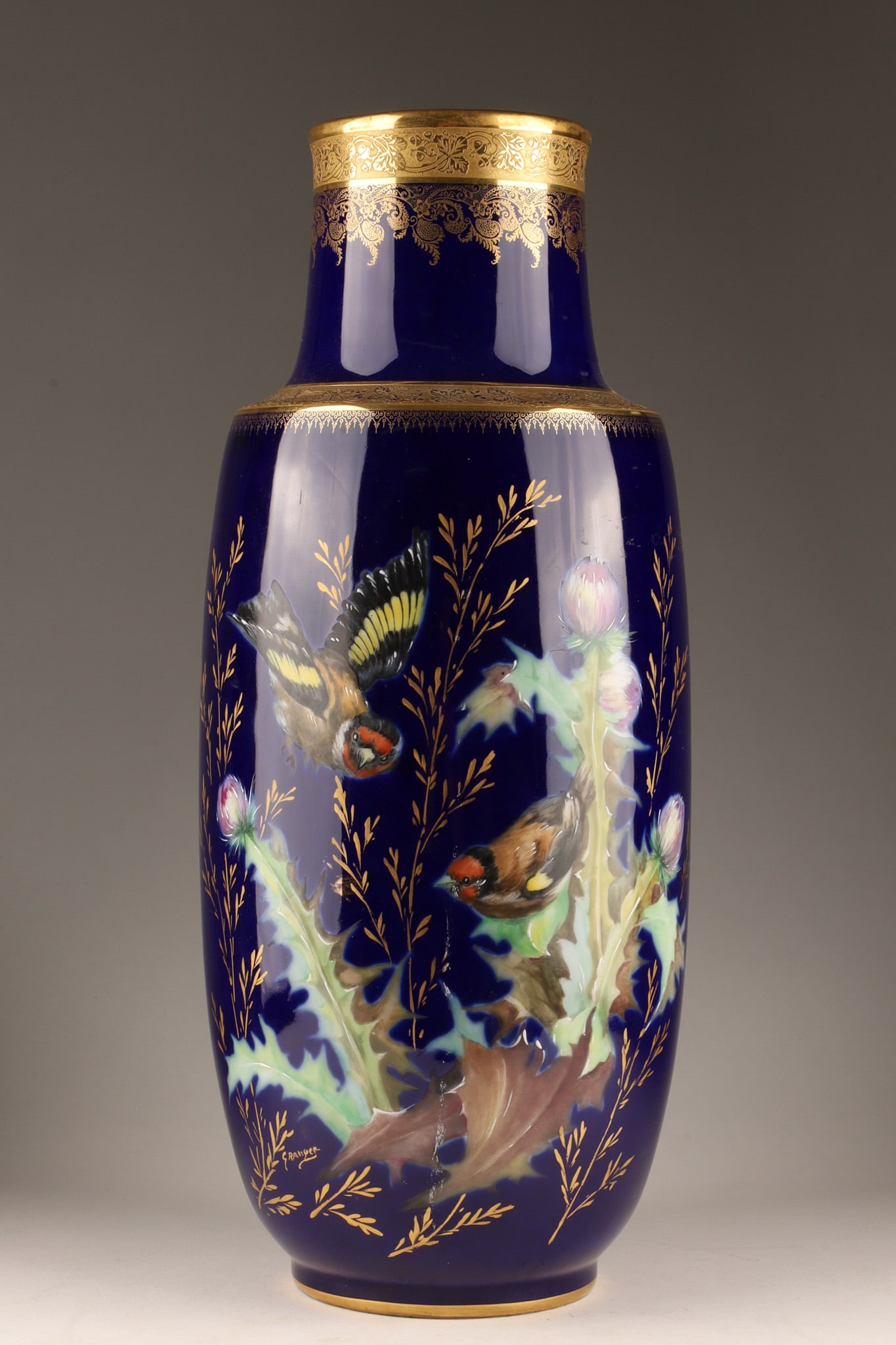 Limoges Vase Hand Painted Birds among Thistles with Gilt Decoration: Limoges Vase Hand Painted Birds among Thistles decorated with ornate gold borders and signed in image, Granger. Marked on base, Decor Main, Veritable Incrustation Or, Label de Qualite with green under