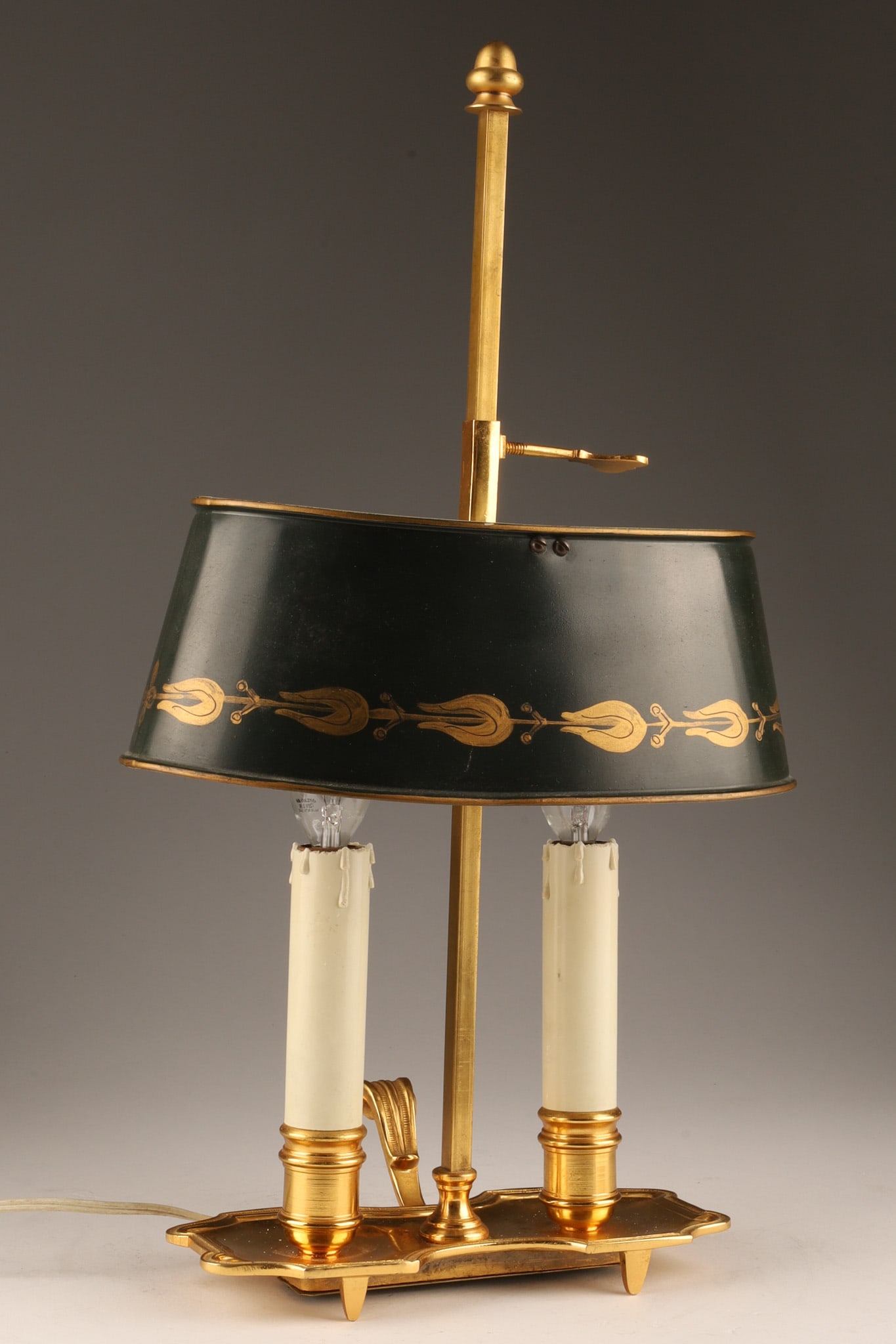 Vintage French Empire Style Gilded Brass Bouillotte Lamp: French Empire style brass bouillotte desk lamp with two candlesticks and gilt painted black metal adjustable shade. Measuring 17 inches H x 9.5 W x 6 deep.