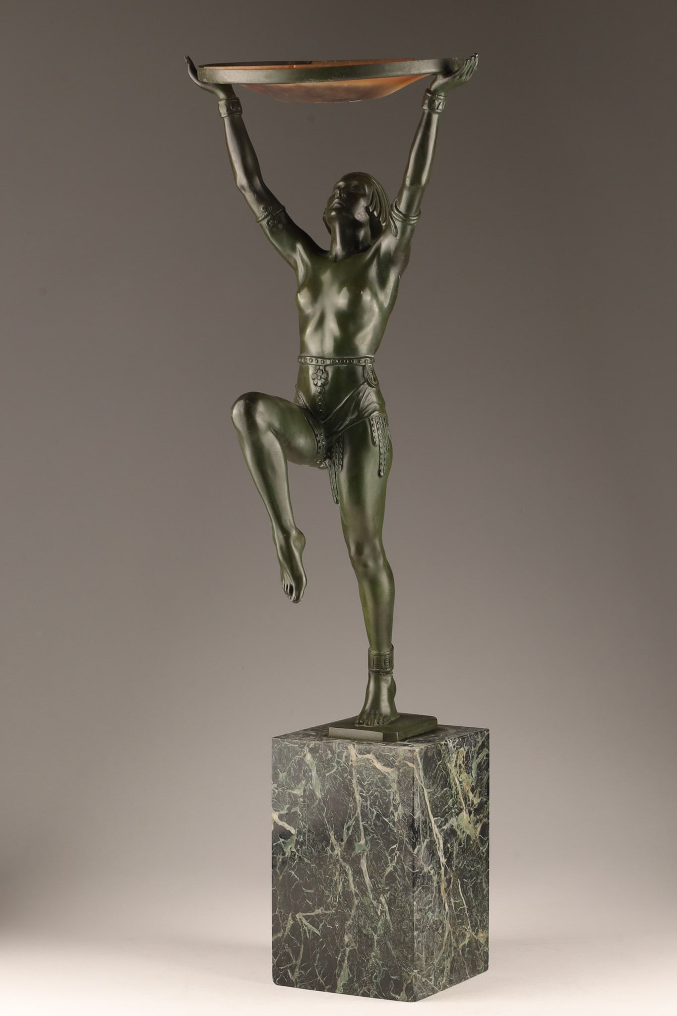 Max Le Verrier 1930 French Art Deco Sculpture Danseuse a la Coupe: Max Le Verrier 1930 French Art Deco Sculpture Danseuse a la Coupe, featuring a patinated art metal dancer figurine holding a pressed glass disc, elevated on a dark green marble base, signed M. Le Verr