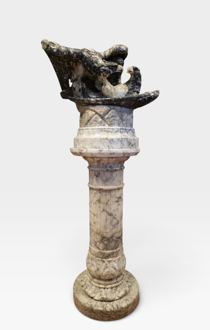 Large and Impressive Carved Alabaster Sculpture Intertwined Eagles on Column Pedestal: A late 19th or early 20th-century carved alabaster sculptural group depicting two intertwined eagles in dynamic poses. The figures display finely detailed plumage, sweeping wingspans, and distinctive 