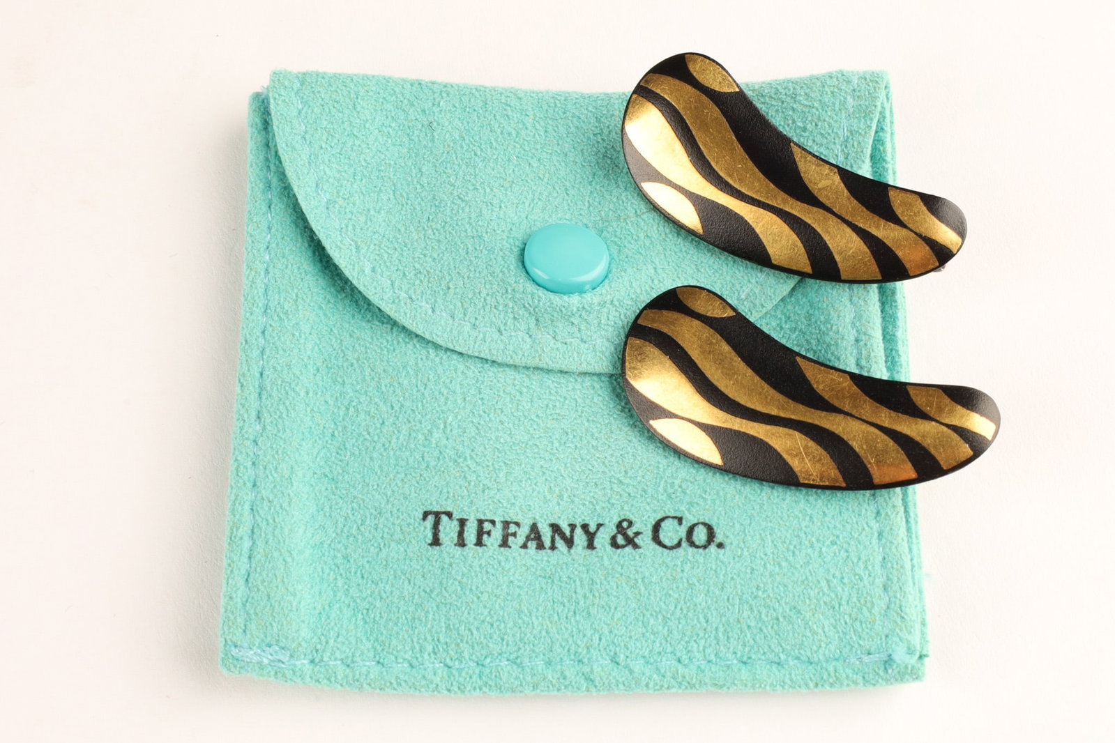 Tiffany and Co 24K Gold, Silver and Iron Damascene Barrettes by Angela Cummings: Rare vintage hair combs designed by Angela Cummings for Tiffany and Co. between 1977 and 1980. The design is inspired by the ancient Damascene technique, featuring 24K gold wash ripple decoration on a