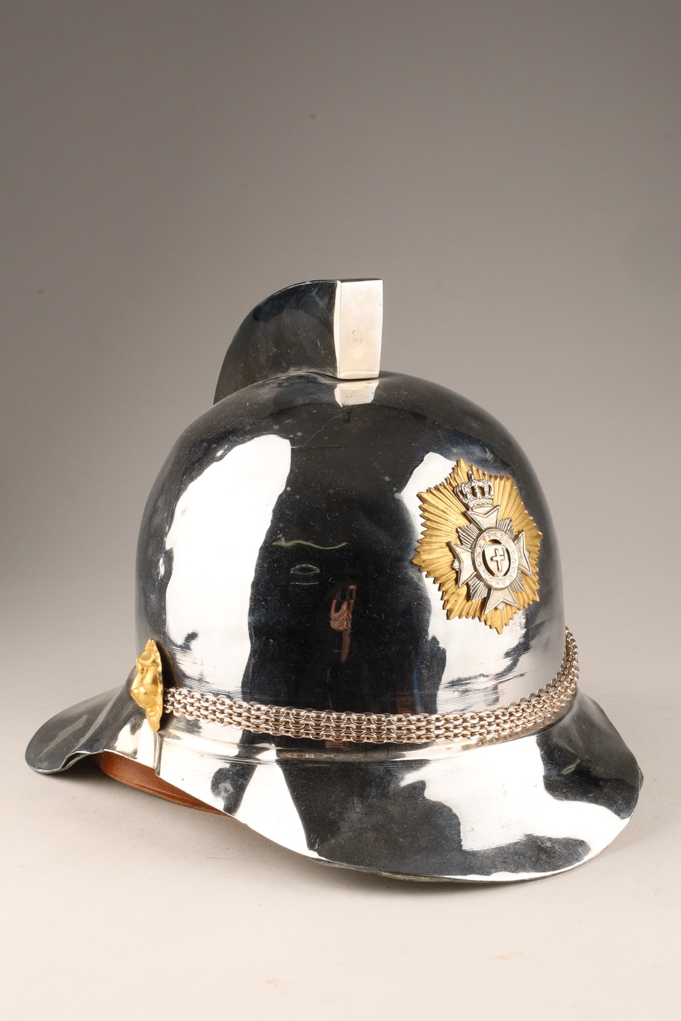 MCM Greek Ceremonial Police Helmet in a Classic Pickelhaube Style: MCM Greek Ceremonial Dress Police Helmet in a Classic Pickelhaube Style, featuring a crowned golden sunburst star with a central silver cross and the Greek word for police. Dating to the mid-20th cent