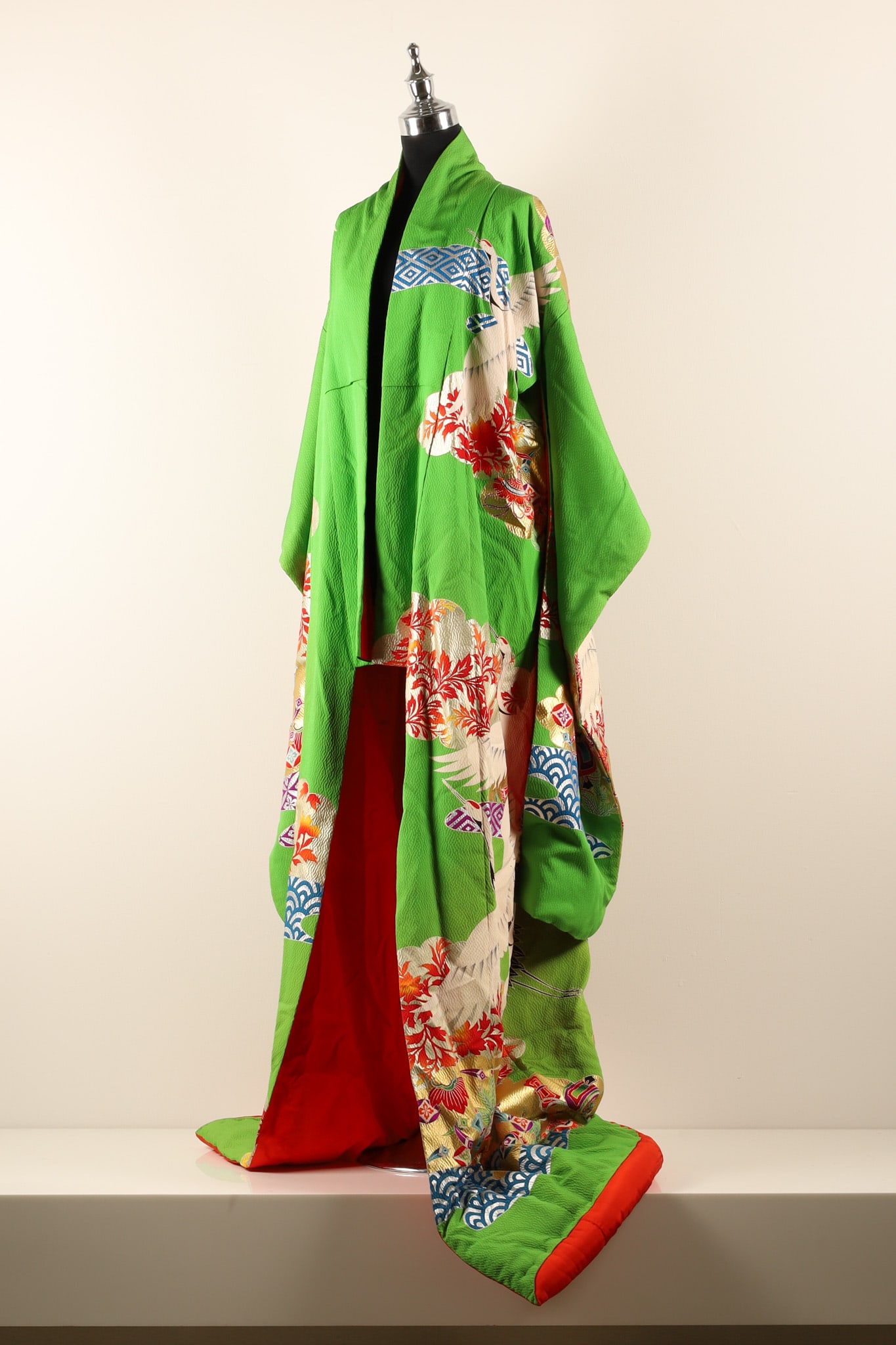 Japanese Vintage Uchikake Apple Green Silk Bridal Marriage Kimono: THE SIMON CHANG COLLECTION - A splendid Japanese vintage uchikake silk bridal marriage kimono, the bright apple green silk with a cloud design showing auspicious objects and foliage in reds and orange