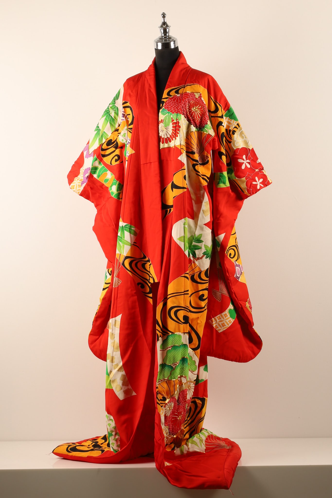Japanese Vintage Uchikake Bright Red Silk Bridal Marriage Kimono: THE SIMON CHANG COLLECTION - A stunning Japanese vintage uchikake silk bridal marriage kimono, the bright red silk ground with a stylized swirling pattern of fans and curved panels showing foliage and