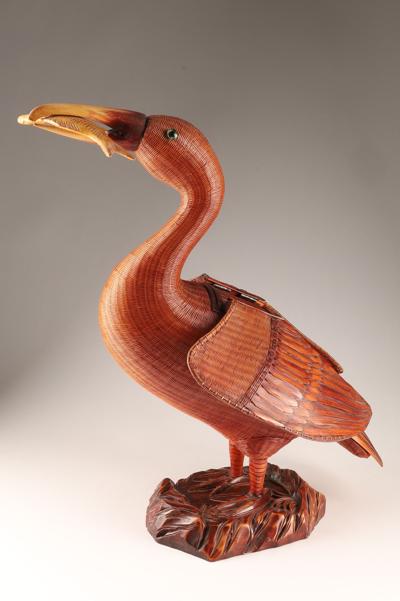 Chinese Large Shanghai Weave Rattan Pelican Sculpture Box: THE SIMON CHANG COLLECTION - A beautifully crafted large Chinese vintage Shanghai weave rattan sculpture box of a a pelican having caught a fish, the wings tilting back to reveal a wood lined inner st