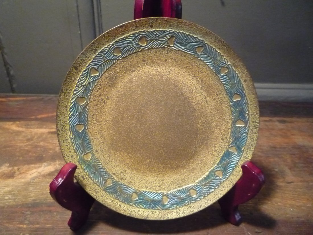 Tiffany Studios bronze tray with blue Peacock-eye: Tiffany Studios bronze tray with blue Peacock-eye border. Stamped Tiffany Studios New York 1741. Diameter 6".