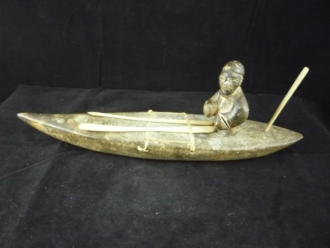 Inuit Soapstone Carving: Inuit Soapstone Carving. Fisherman on canoe.