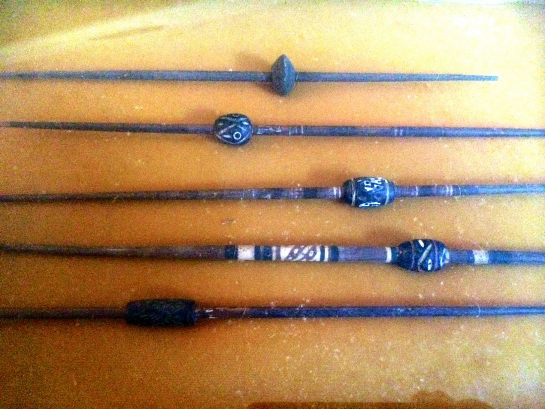 5 Peruvian Weavers' Spindles of the Chancay Culture: 1100-1450 A.D., artifacts, carved and hand-painted. Spindles are 9-10" each, framed in shadow box.