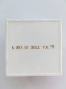 YOKO ONO: "Box of Smile Y.O. '71" Engraved plastic box contains mirror. 2 3/8 x 2 1/8 x 2 1/8. Reflux hot stamp.