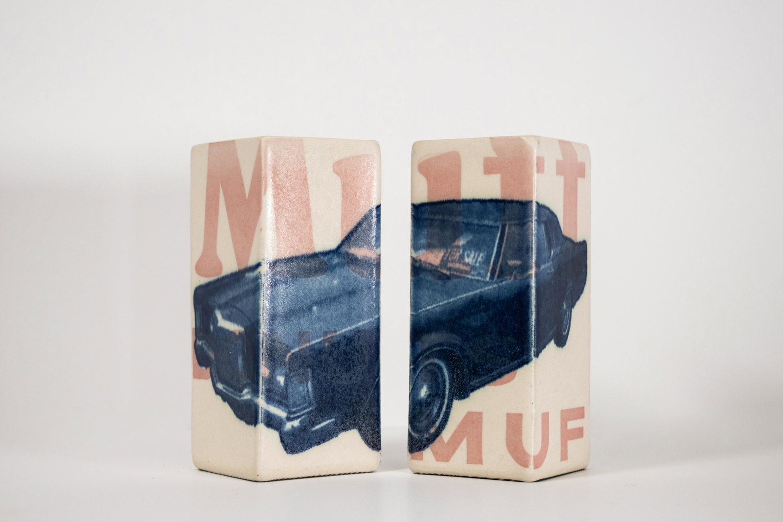 David Allyn (American 20th Century): Vase pair with Blue Camaro, circa 2013, porcelain with transfer and glazing, embossed signature, 6"" high, 2.5 x 2.5"" square, each.