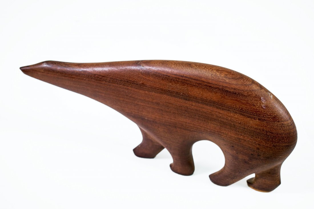 Arne Tjomsland, attri. (Norwegian, 1915 - 1970): Teak polar bear. Branded "Norway" Hiorth & Ostlyngen Furniture, Oslo, Norway (attribution). 10 3/4 x 4 3/4 x 1 1/8 inches. (sight).