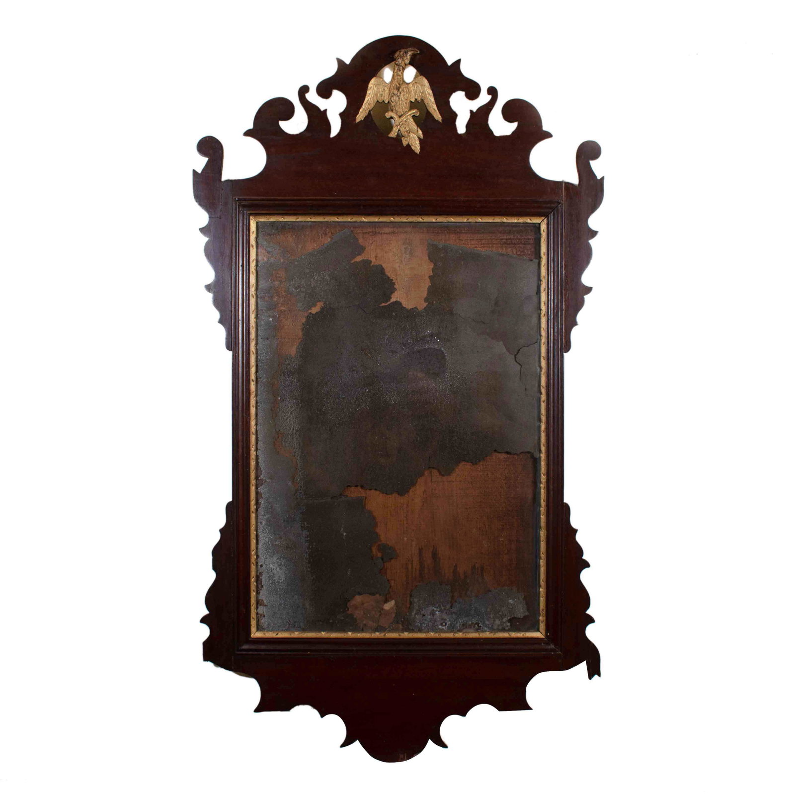 American Mahogany Gilt Chippendale Mirror: Intricately carved and with original glass and mirror surface. 36 x 20 inches.