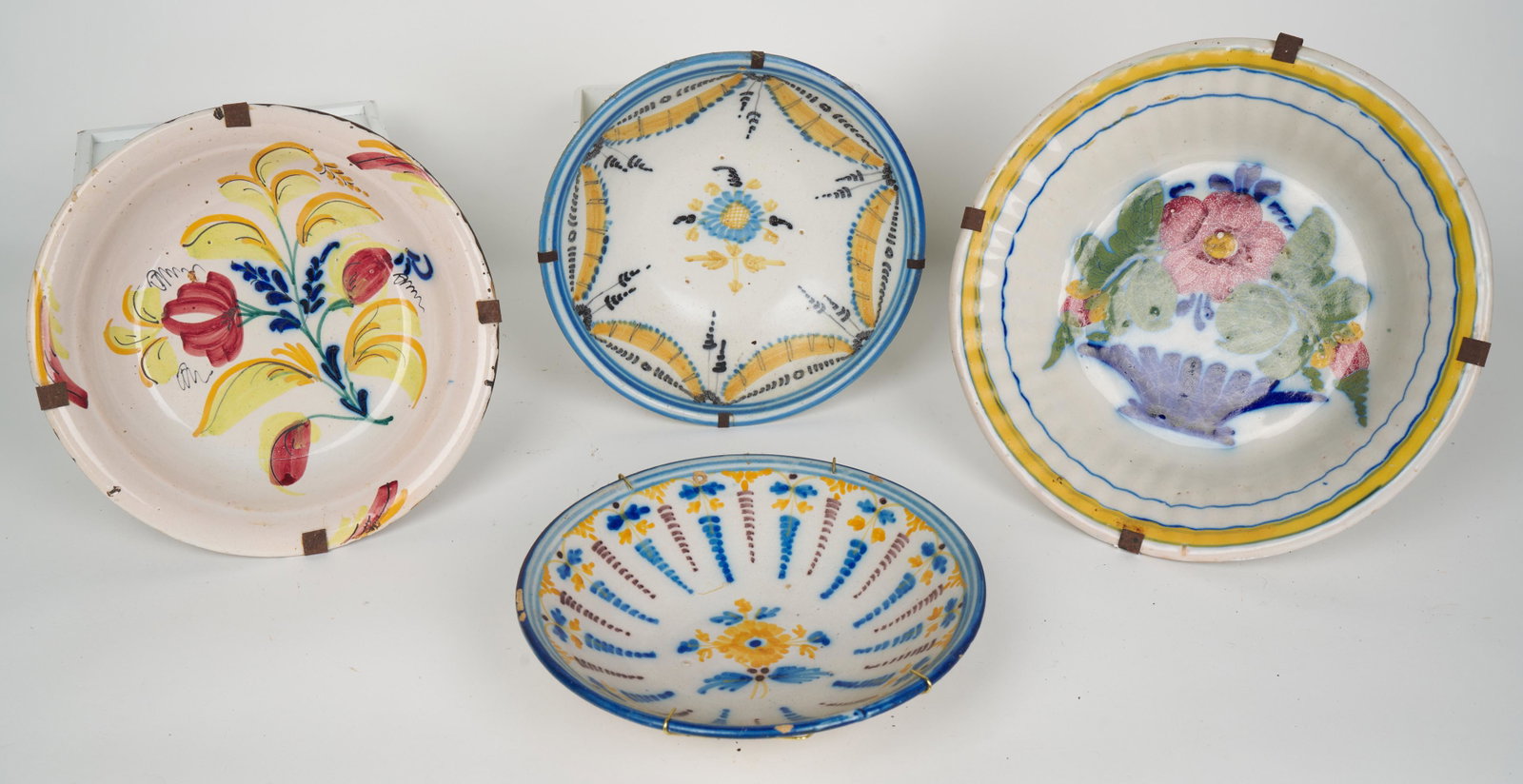 Spanish Fajalauza Talavera (Antique): Four antique bowls. 12 W x 2 1/4 H in. (largest and approximate. All with old hangers. Provenance: Marietta Berman (Czech-Venezuelan artist, 1917 - 1990) acquired in Cuenca, Spain in the mid-1970s and