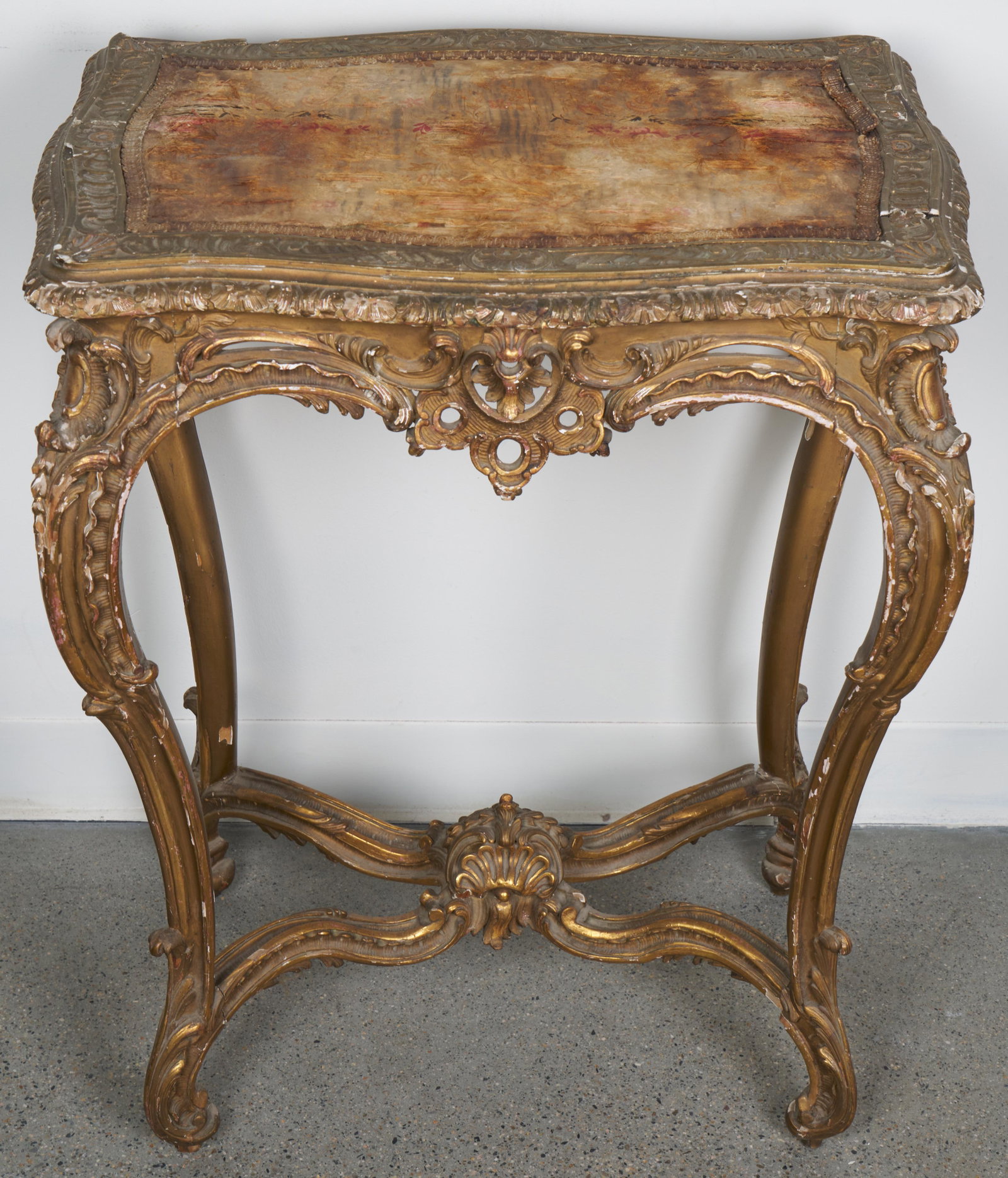 Louis XVI Style Table (Antique): Carved table with a silk upholstered top. 35 H x 27 W x 24 D".