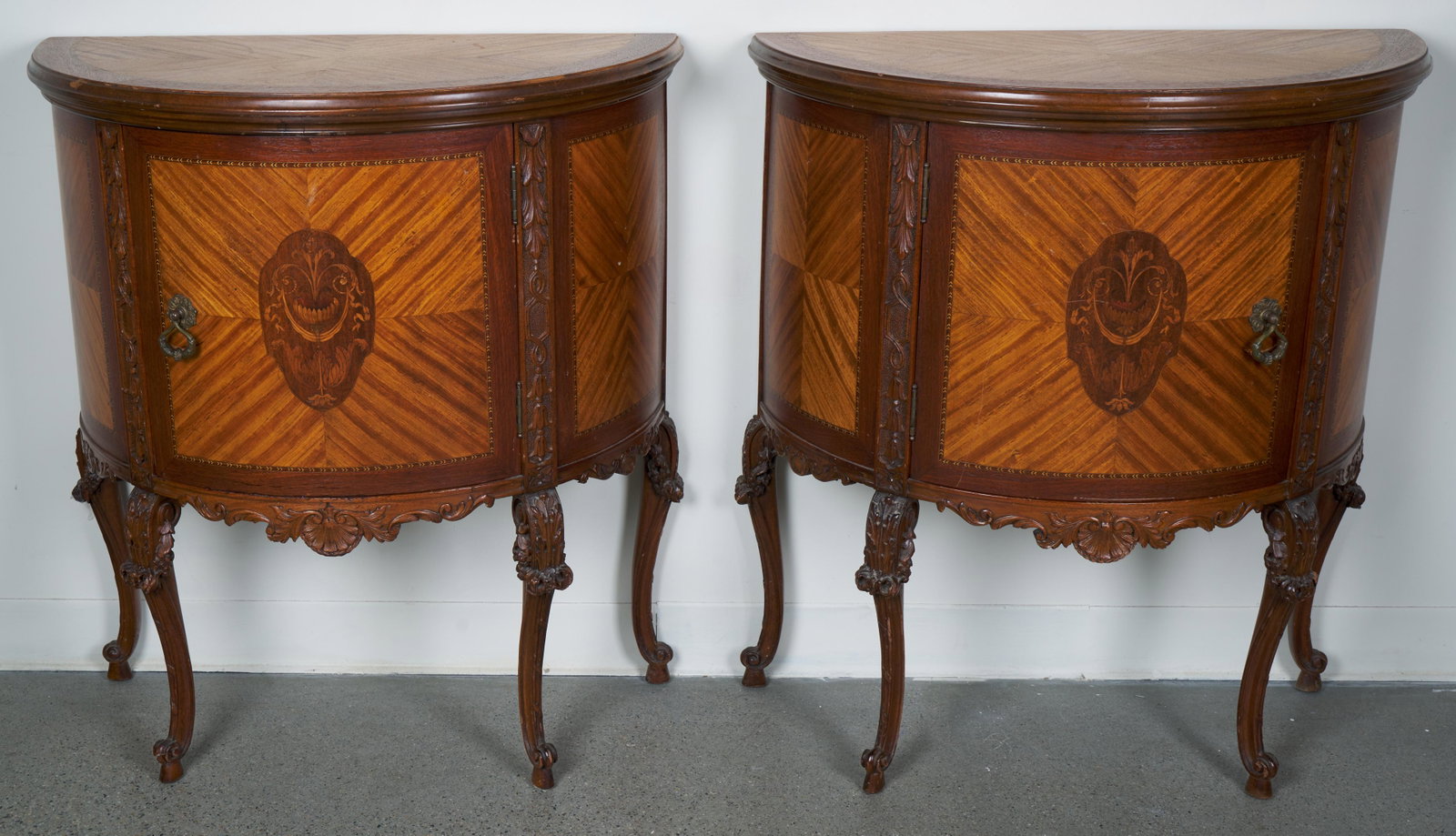 French Demilune Cabinets (Antique): Inlaid and carved. 29 1/2 x 15 1/4 x 33 1/2" (LxWxH).