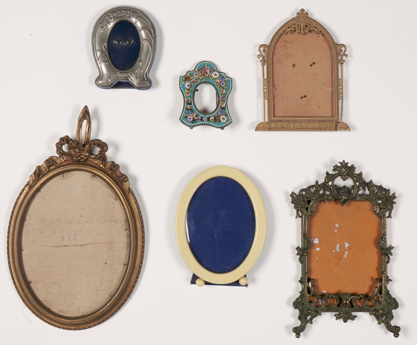 Table Frames (Antique): Various makers, styles and materials. The carved gilded wood frame is the largest 7 x 12".