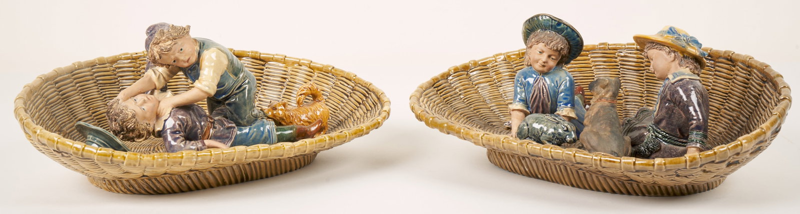 Brothers Urbach Majolica (Czech, 19th Century): 'Girls Playing and Boys Fighting.' Two pottery arrangements. both with the BU mark and number on the bottom. Each is 14 x 6 x 4" (sight).