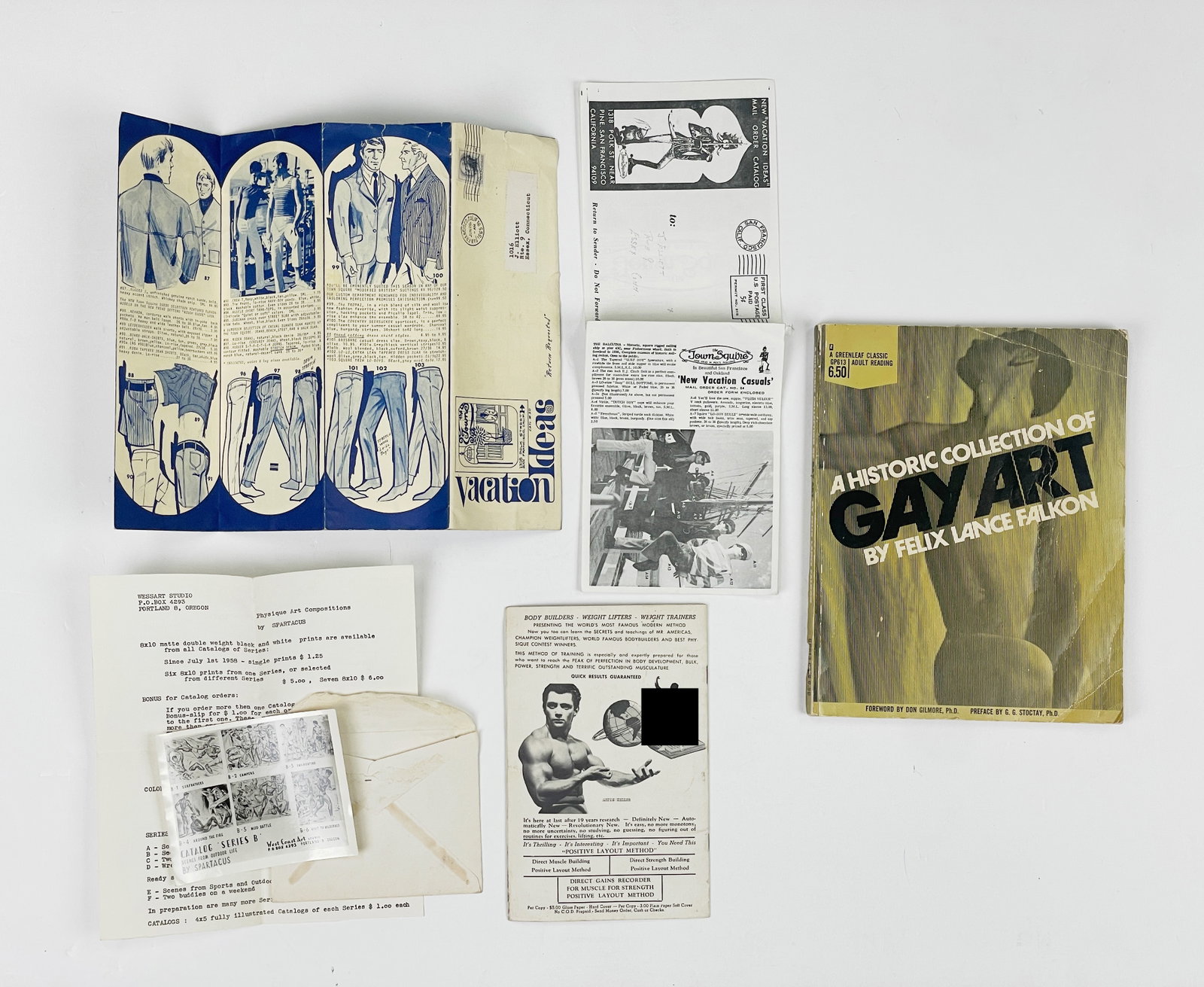 Gay American Vintage Ephemera (Circa 1950s - 1970s): One issue of "Physique World" Vol. 1 No. 2. Circa 1956; One homoerotic men's summer mail order fashion catalogue. "Vacation Ideas". Published by the Town Squire, San Francisco. 1965. Offset; One issue