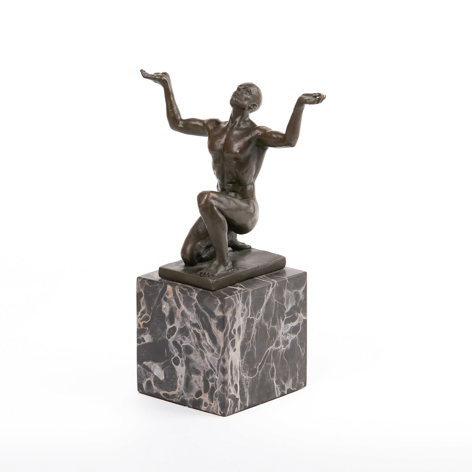 Miguel Fenando López 'Milo' (Portugese, b. 1955): "Kneeling Adonis." Bronze on a black marble base. 7 x 3 x 5 1/2" (sight).