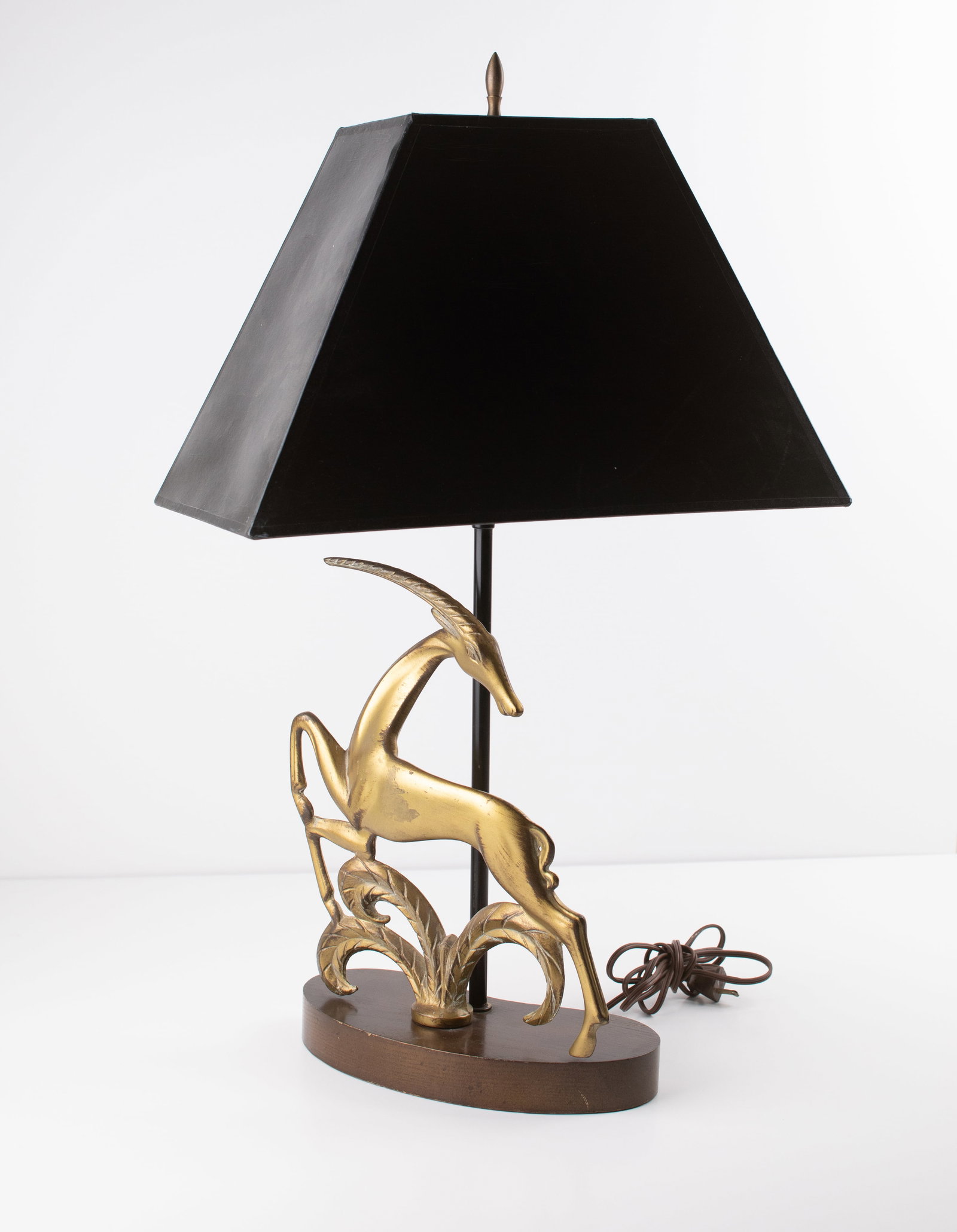 Art Deco Lamp: Brass sculptural lamp on wooden base. 26 x 16 x 9". Provenance: property of a Providence, Rhode Island collector.