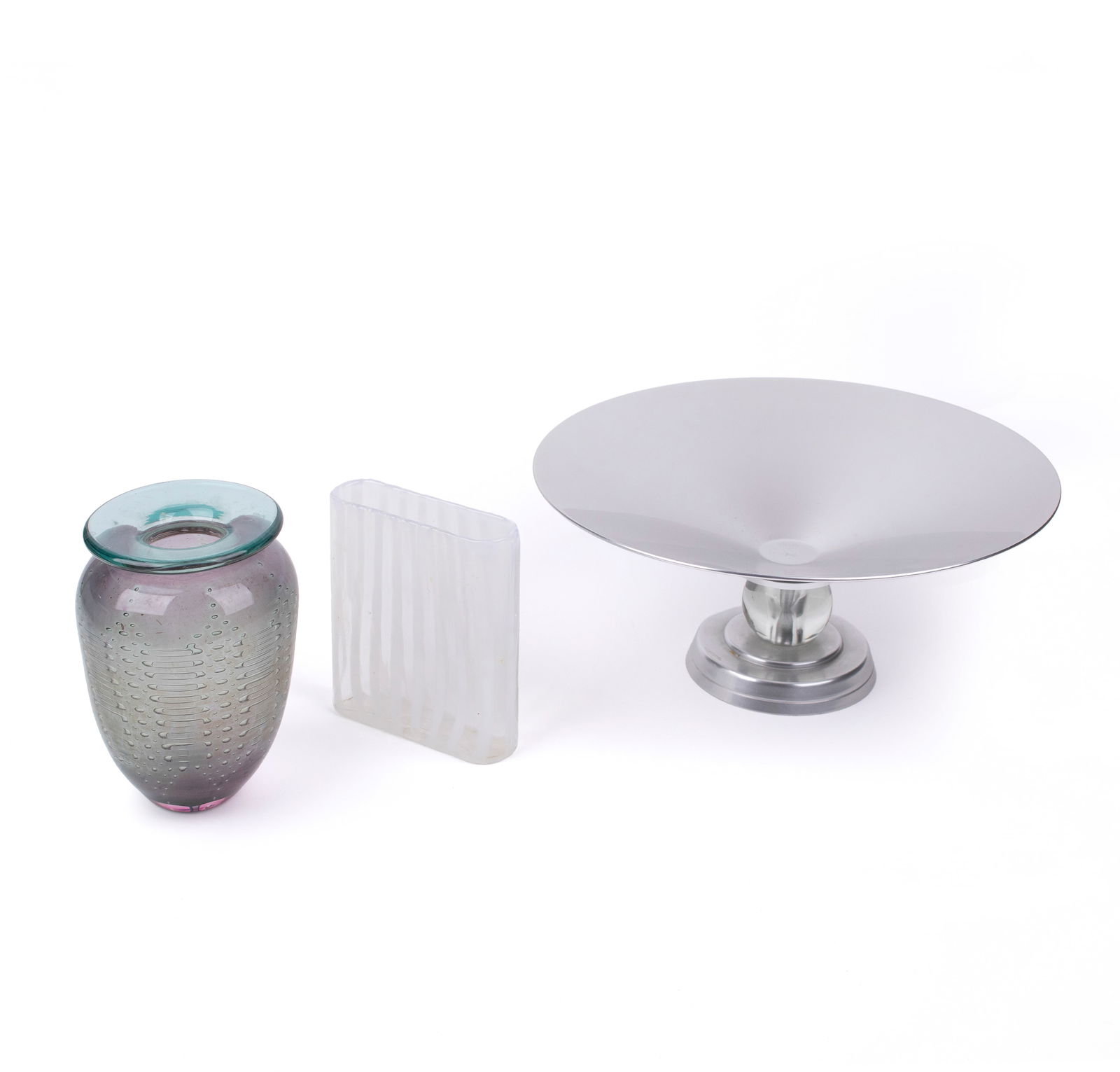 Lurelle Guild and Murano (20th Century): Two Murano glass vases (unmarked), together with a Lurelle Guild aluminum and glass center bowl (circa 1940s). 7" 1/4 x 5" (sight, larger vase); 13" x 6" (sight, aluminium bowl).