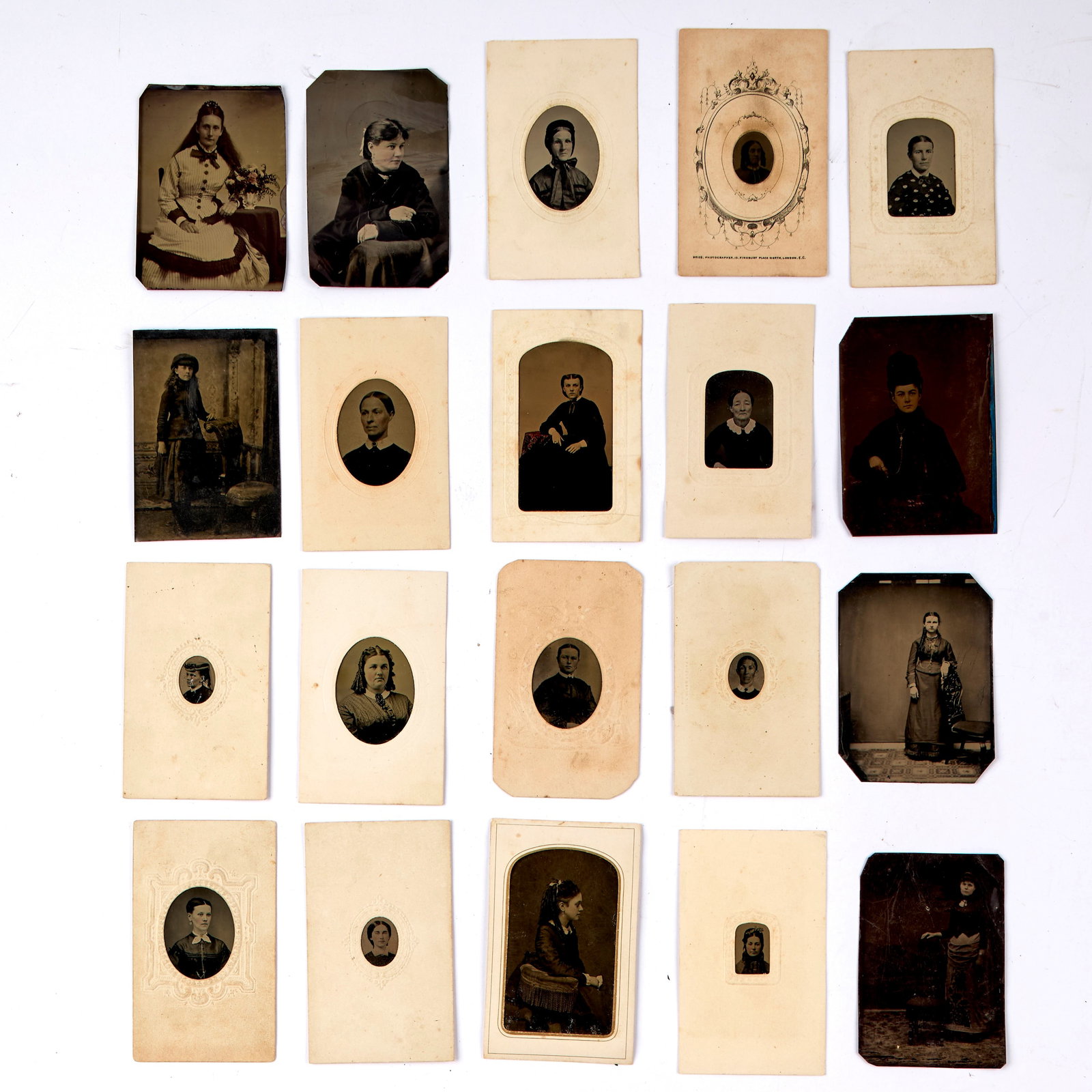 Tintype Collection of Women (19th Century): Twenty (20) tintype portraits of women in various poses. Loose and paper-mounted. Largest ; 4 x 2.5" Provenance: property of a private Connecticut collection. Shipping: At checkout, you can choose int