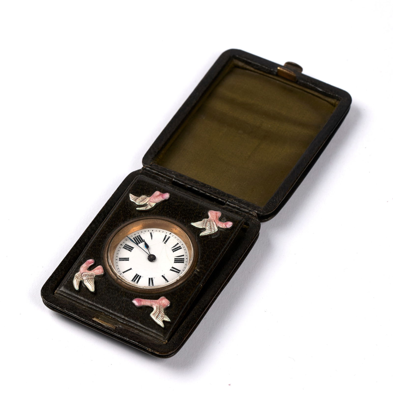 Homoerotic Travel Clock (British, Antique): Leather-cased small travel clock with four (4) enamel winged phalluses surrounding the clock face. Marked "J.C. Vickery 179, 181, 183, Regent St. W." on the interior of the case. Includes winding key.