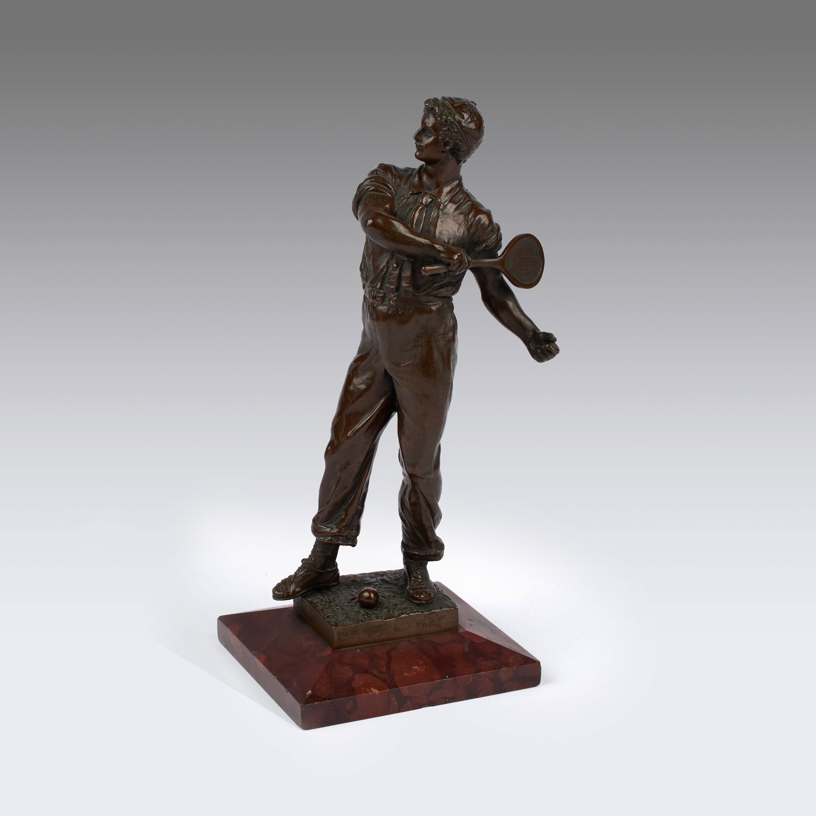 European School (20th Century): Tennis Player. Cast bronze on a red marble base. Signed on base. Artist unknown or signature unidentified. Weight: approx. 3 1/2 lb. 9 1/2 x 4 x 4" (sight). Provenance: property of a private Rhode Isl