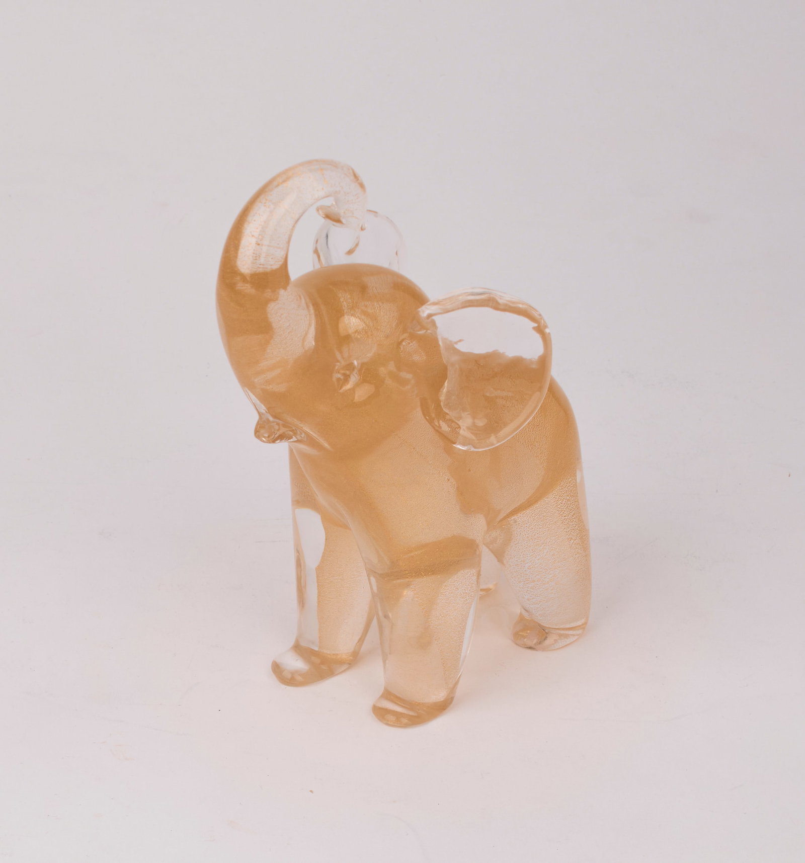 Archimede Seguso (Italian, 1909-1999): A Mid-century Murano glass elephant with gold flake detail within. Signed on the bottom of the back right foot. Measures approx: 6 1/2 x 2 1/2 x 4".