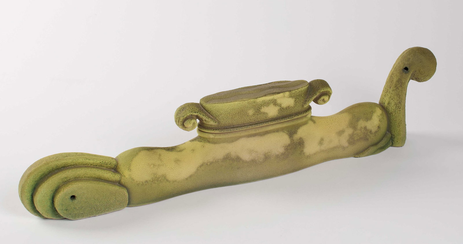 Mark Derby (American, b.1960): 1999. A slab and press-molded abstract pottery vessel. Textured green glaze over terracotta. Signed and dated on the bottom. 25 x 5 x 3". The artist lives and works in New Orleans and is heavily