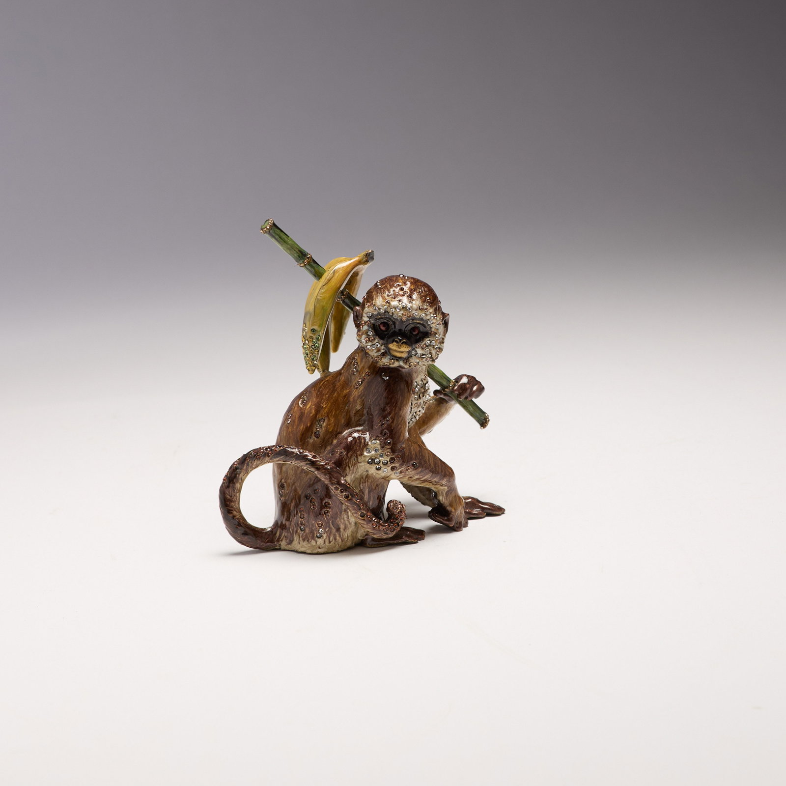 Jay Strongwater (Rhode Island): "Lester." From the Neiman Marcus "Paradise Exclusives" collection. An embellished enameled monkey figurine. In original dust bag. No box included. 4 1/2 x 4 1/4 x 