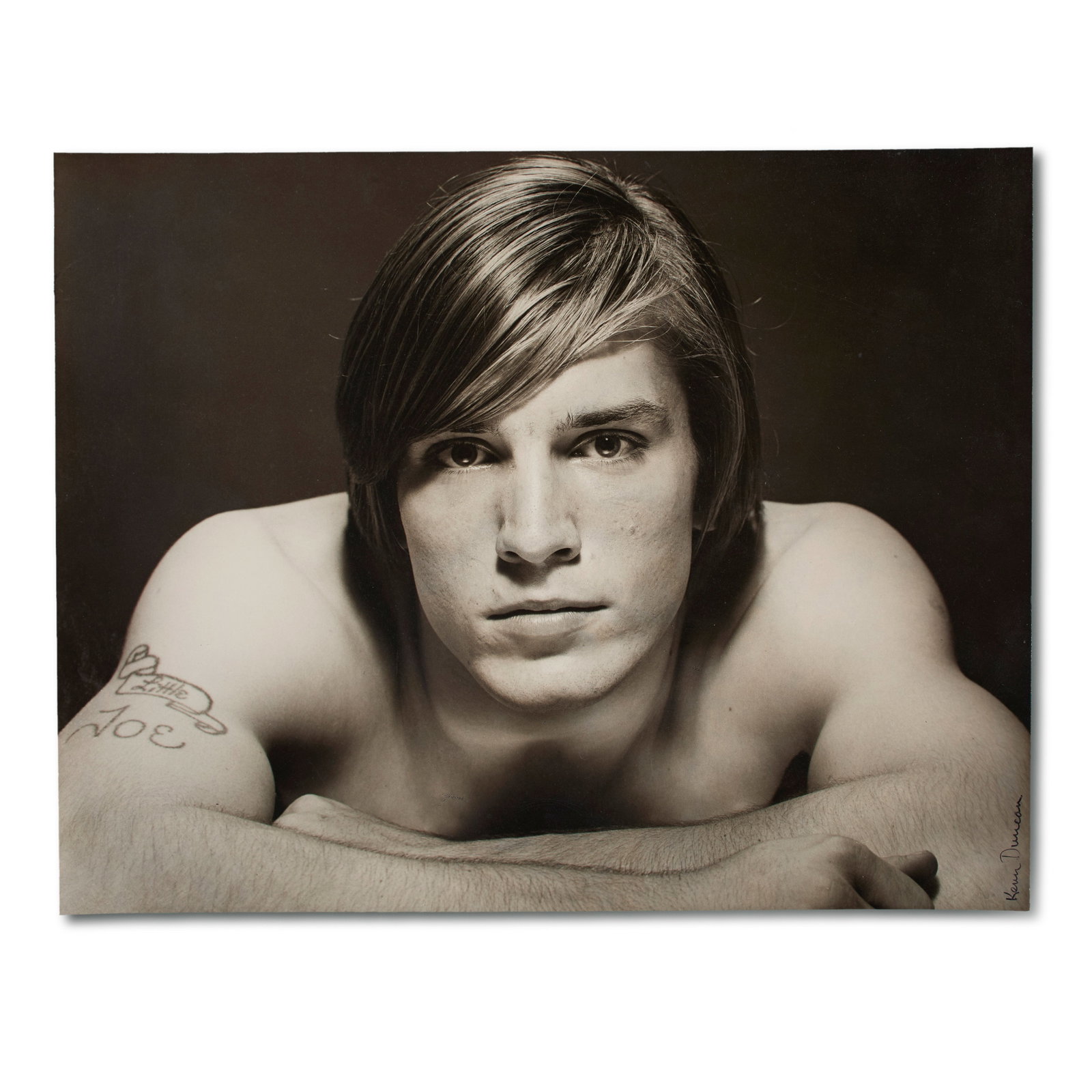 Kenn Duncan (American, 1928-1986): Little Joe (Portrait of Joe Dallesandro), c. 1970. Gelatin silver print. Signed in ink on the bottom right, "Kenn Duncan". An attractive portrait of Joe Dallesandro by the American pho